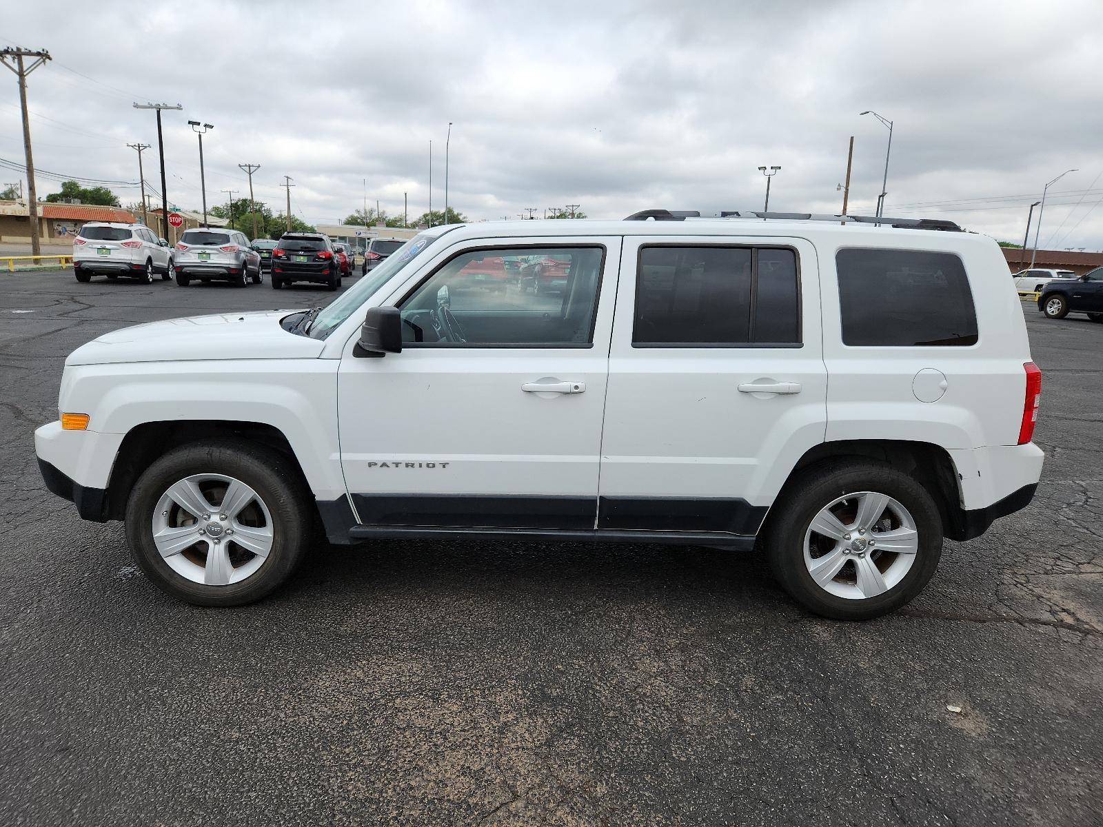 2012 Bright White /Dark Slate Gray Leather Interior Jeep Patriot Limited (1C4NJPCB9CD) with an 2.4L DOHC 16V I4 DUAL-VVT ENGINE engine, located at 4711 Ave Q, Lubbock, TX, 79412, (806) 687-2362, 33.551304, -101.855293 - Photo #1