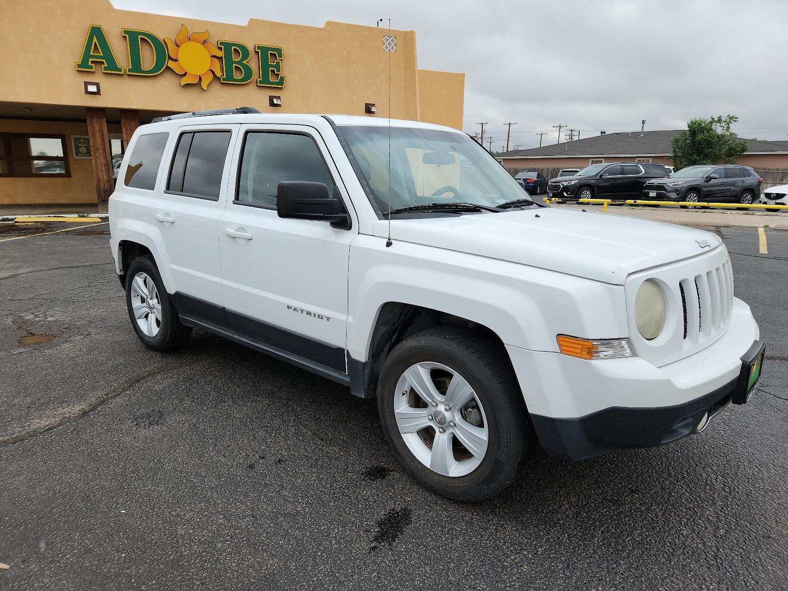 2012 Bright White /Dark Slate Gray Leather Interior Jeep Patriot Limited (1C4NJPCB9CD) with an 2.4L DOHC 16V I4 DUAL-VVT ENGINE engine, located at 4711 Ave Q, Lubbock, TX, 79412, (806) 687-2362, 33.551304, -101.855293 - Photo #5