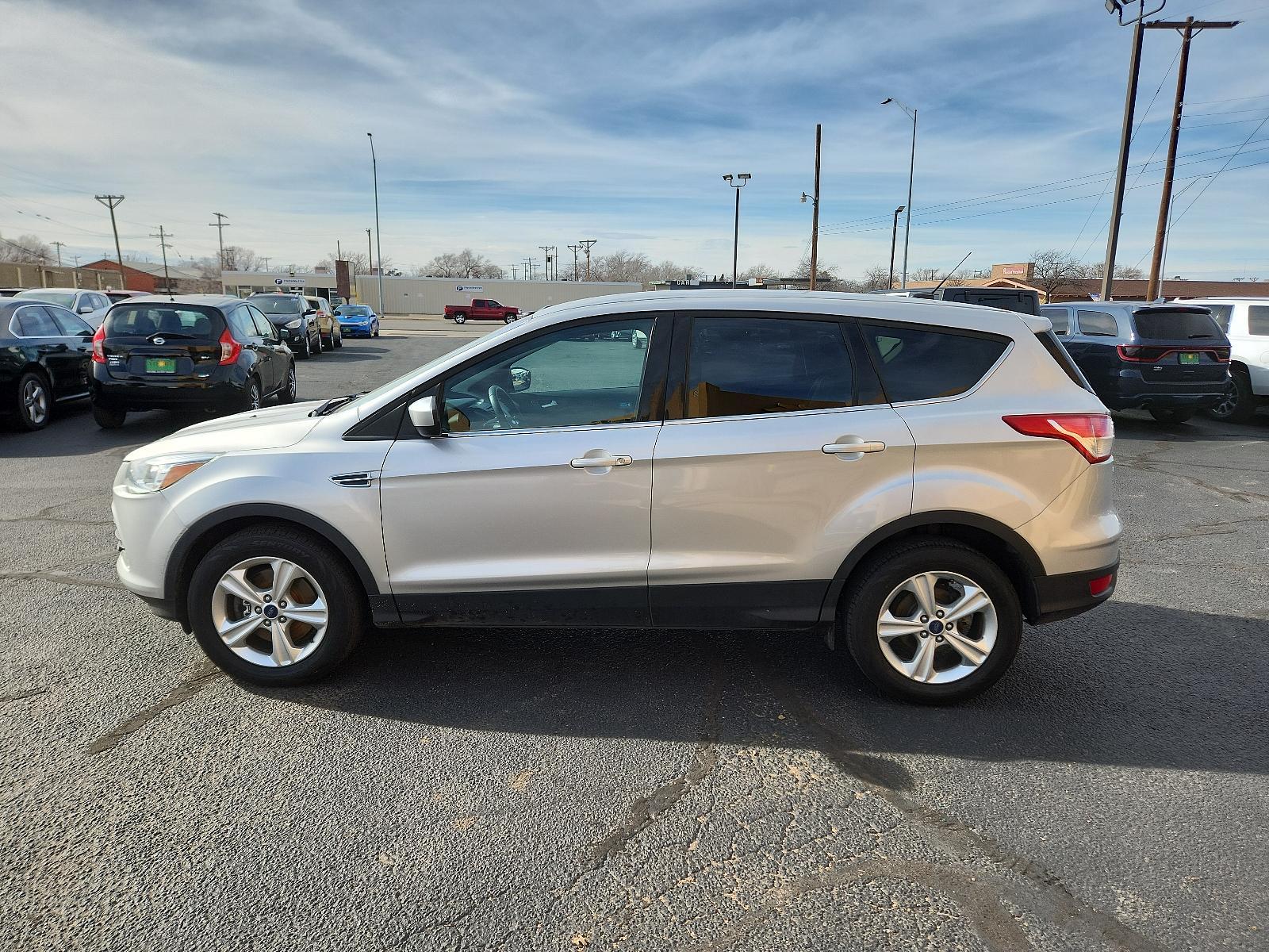2015 Ingot Silver Metallic /Charcoal Black Ford Escape SE (1FMCU9GX2FU) with an ENGINE: 1.6L ECOBOOST engine, located at 4711 Ave Q, Lubbock, TX, 79412, (806) 687-2362, 33.551304, -101.855293 - Photo #1