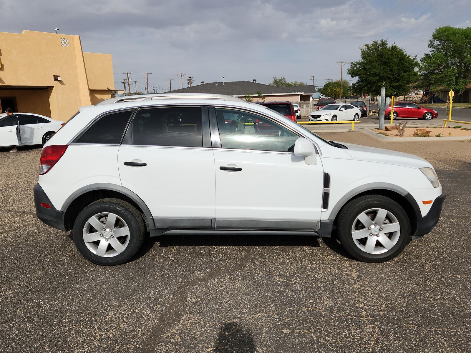 2012 Arctic Ice /Black Chevrolet Captiva Sport Fleet LS w/2LS (3GNAL2EK3CS) with an ENGINE, 2.4L DOHC 4-CYLINDER SIDI (SPARK IGNITION DIRECT INJECTION) engine, located at 4711 Ave Q, Lubbock, TX, 79412, (806) 687-2362, 33.551304, -101.855293 - Photo #5