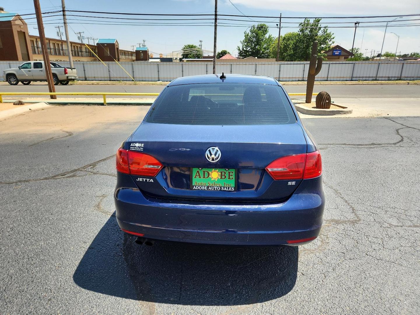 2014 Tempest Blue Metallic /Titan Black Volkswagen Jetta Sedan SE (3VWD17AJ9EM) with an Engine: 1.8L l-4 DOHC engine, located at 4711 Ave Q, Lubbock, TX, 79412, (806) 687-2362, 33.551304, -101.855293 - Photo#3