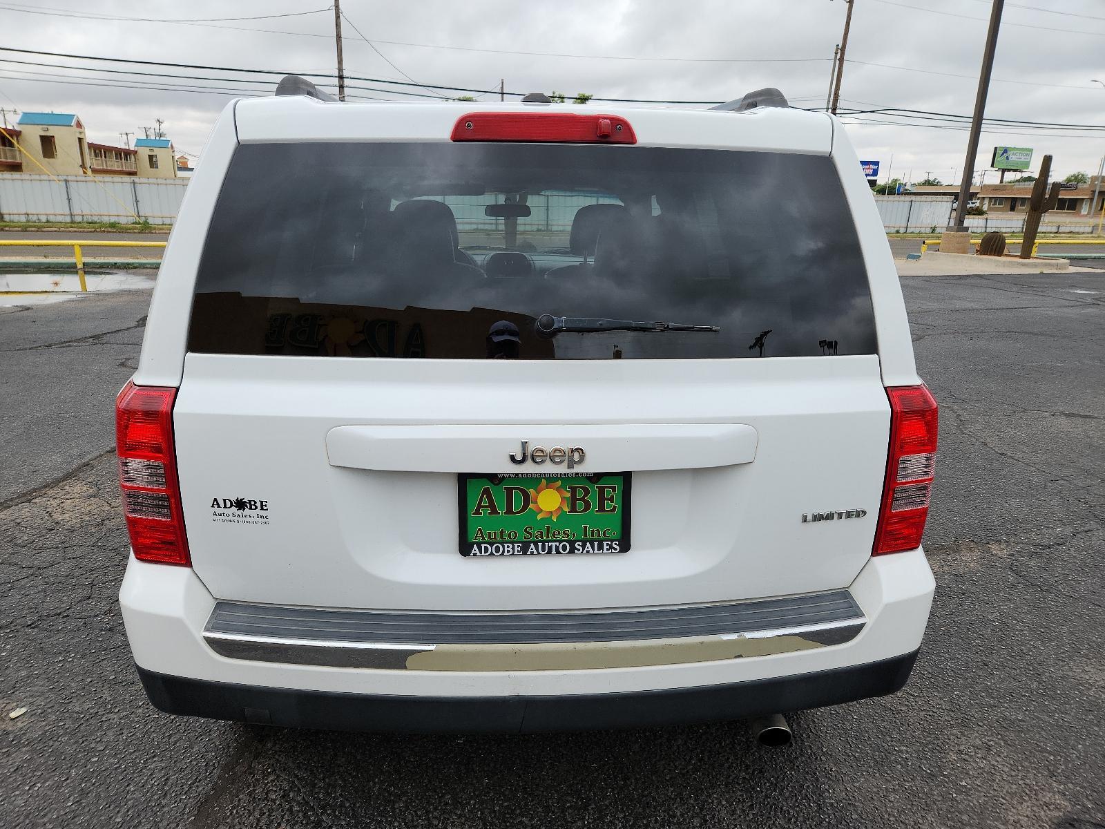 2012 Bright White /Dark Slate Gray Leather Interior Jeep Patriot Limited (1C4NJPCB9CD) with an 2.4L DOHC 16V I4 DUAL-VVT ENGINE engine, located at 4711 Ave Q, Lubbock, TX, 79412, (806) 687-2362, 33.551304, -101.855293 - Photo #3