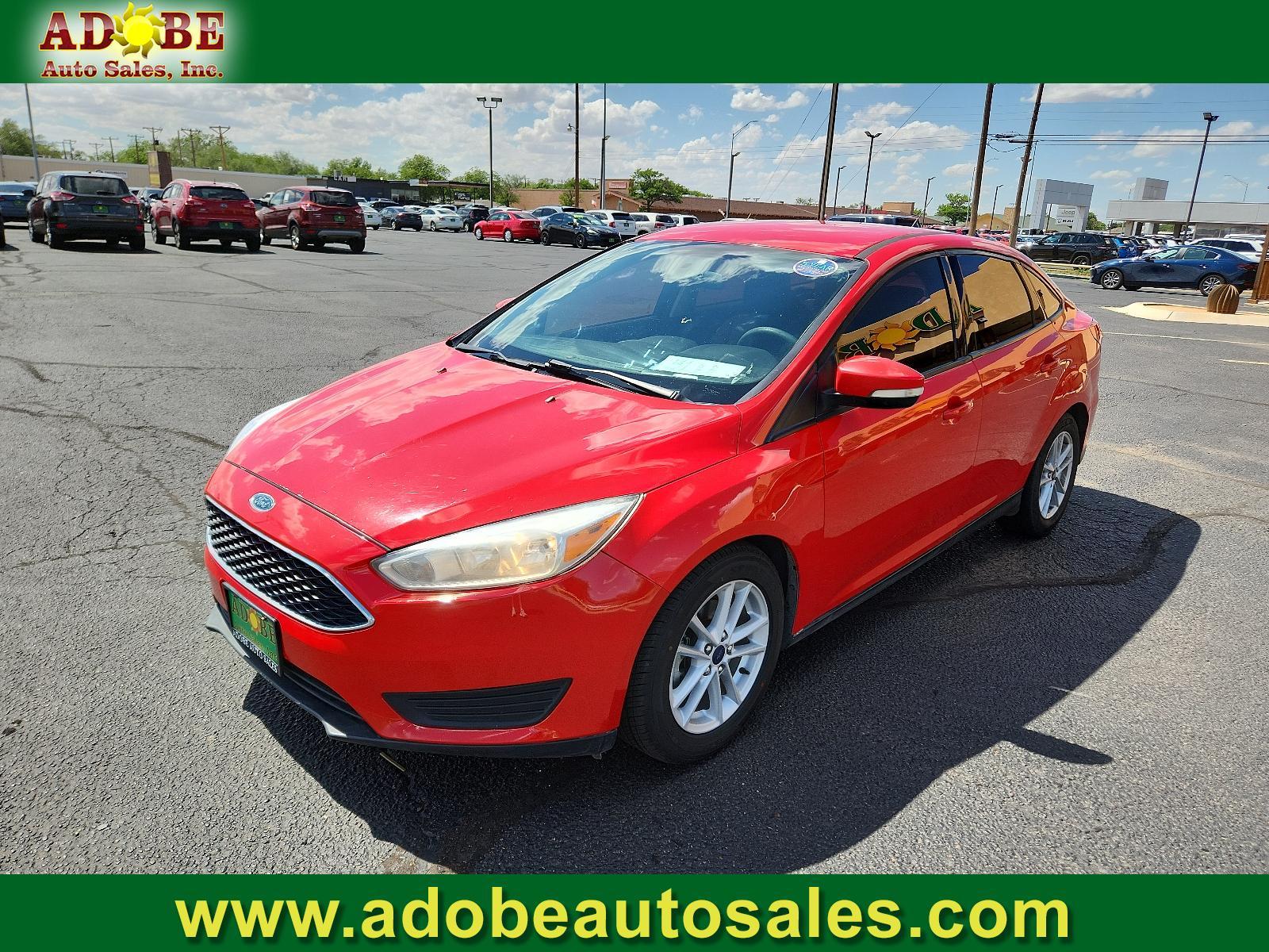 2017 Race Red /Charcoal Black Insert w/Warm Steel Surround, cloth Ford Focus SE (1FADP3F27HL) with an ENGINE: 2.0L I-4 GDI TI-VCT FLEX FUEL engine, located at 4711 Ave Q, Lubbock, TX, 79412, (806) 687-2362, 33.551304, -101.855293 - Photo #0