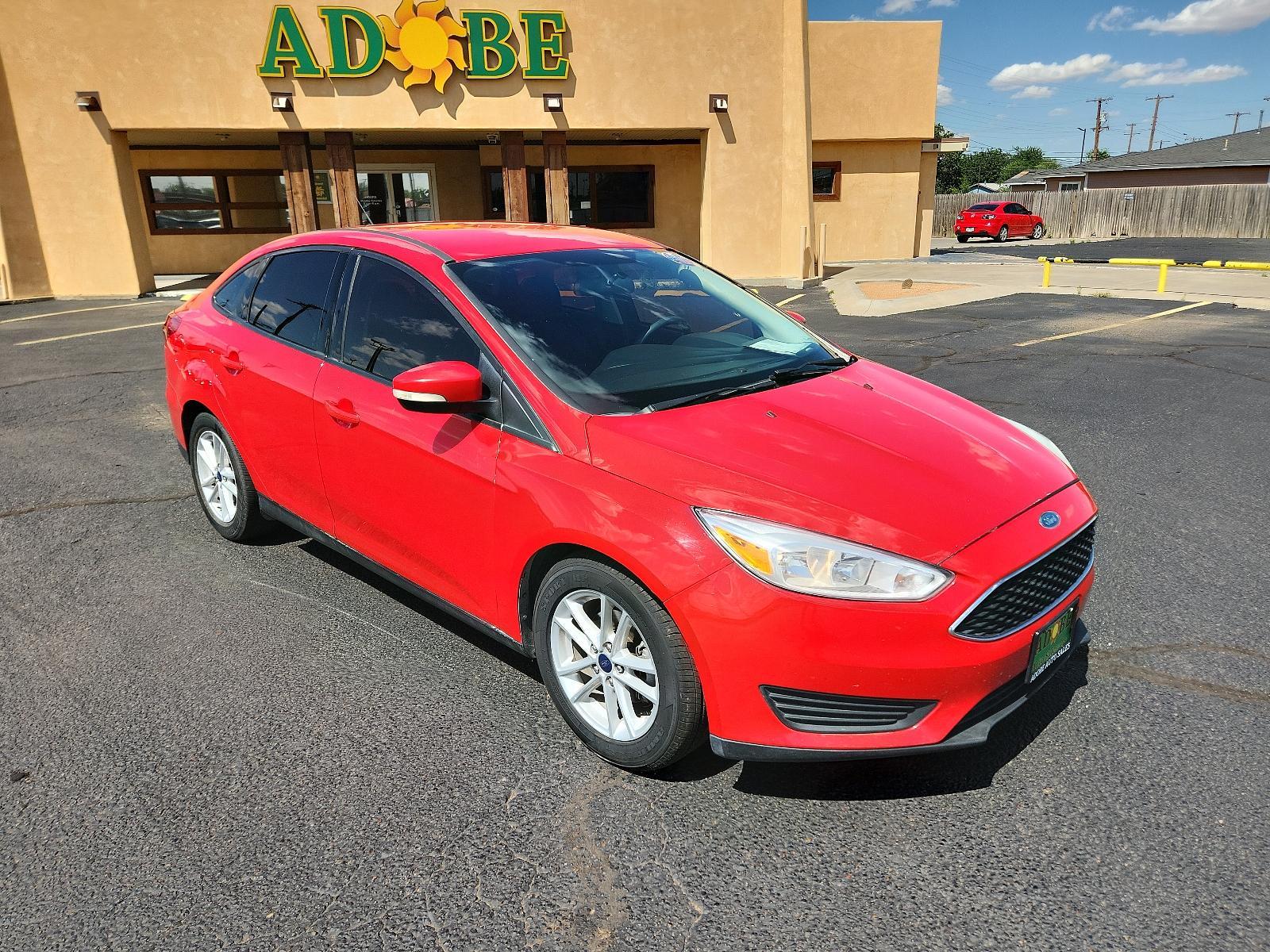 2017 Race Red /Charcoal Black Insert w/Warm Steel Surround, cloth Ford Focus SE (1FADP3F27HL) with an ENGINE: 2.0L I-4 GDI TI-VCT FLEX FUEL engine, located at 4711 Ave Q, Lubbock, TX, 79412, (806) 687-2362, 33.551304, -101.855293 - Photo #6