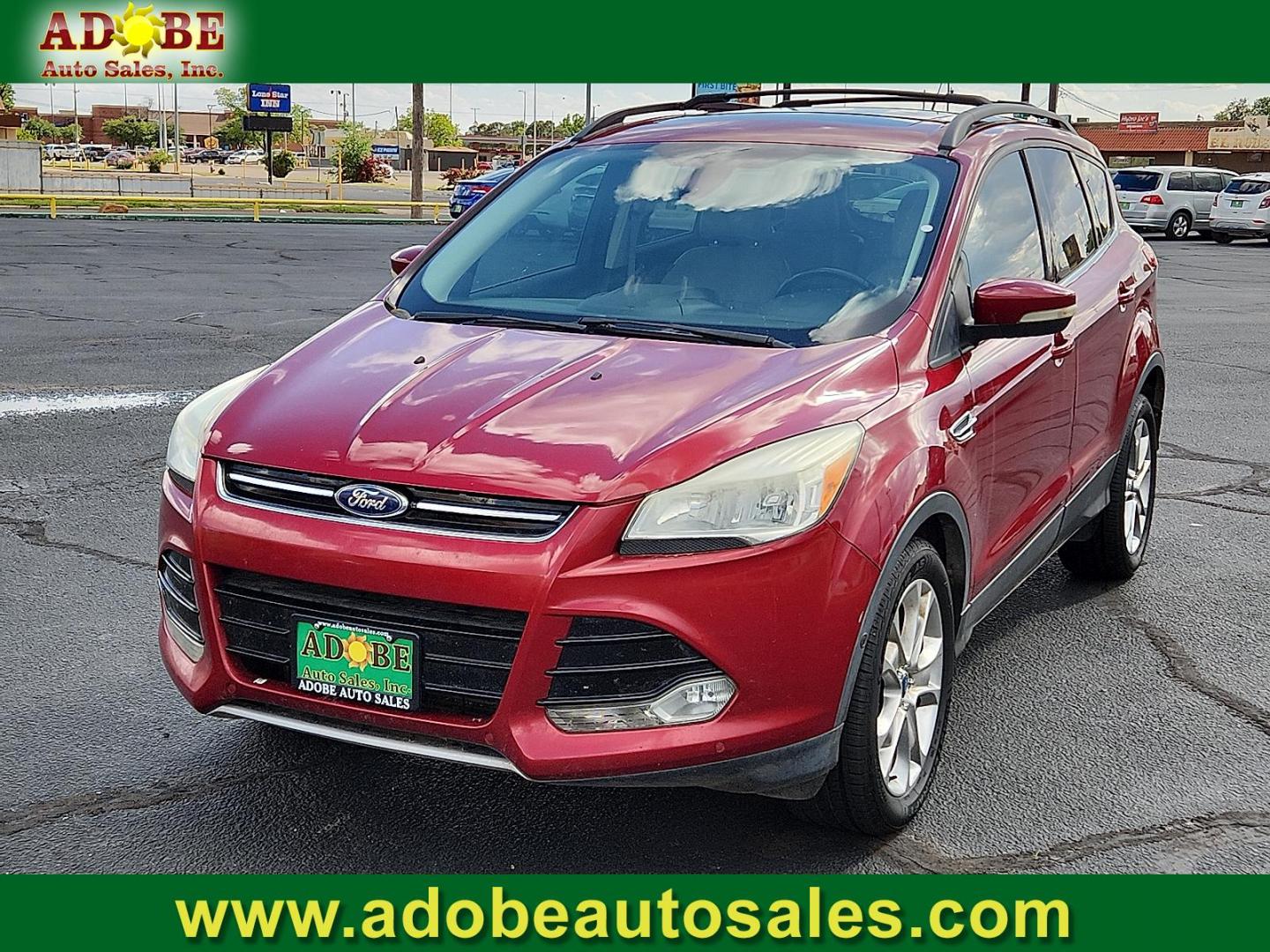2013 Ruby Red Metallic Tinted Ford Escape SEL (1FMCU0H91DU) with an EcoBoost 2L I-4 gasoline direct injection, DOHC, variable valve control, intercooled turbo, regular unleaded, engine with 231HP engine, located at 4711 Ave Q, Lubbock, TX, 79412, (806) 687-2362, 33.551304, -101.855293 - Photo#0