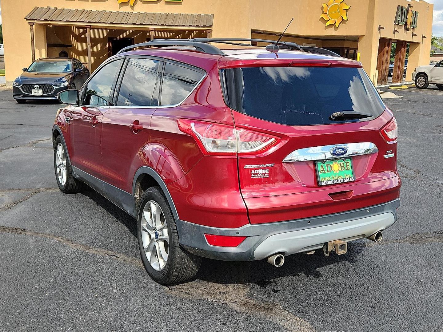 2013 Ruby Red Metallic Tinted Ford Escape SEL (1FMCU0H91DU) with an EcoBoost 2L I-4 gasoline direct injection, DOHC, variable valve control, intercooled turbo, regular unleaded, engine with 231HP engine, located at 4711 Ave Q, Lubbock, TX, 79412, (806) 687-2362, 33.551304, -101.855293 - Photo#2