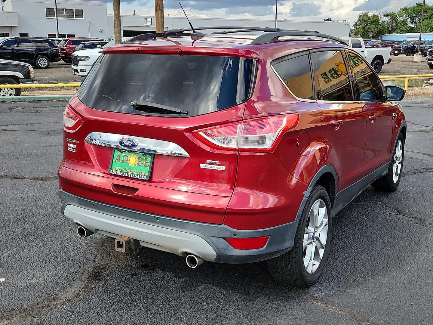 2013 Ruby Red Metallic Tinted Ford Escape SEL (1FMCU0H91DU) with an EcoBoost 2L I-4 gasoline direct injection, DOHC, variable valve control, intercooled turbo, regular unleaded, engine with 231HP engine, located at 4711 Ave Q, Lubbock, TX, 79412, (806) 687-2362, 33.551304, -101.855293 - Photo#3