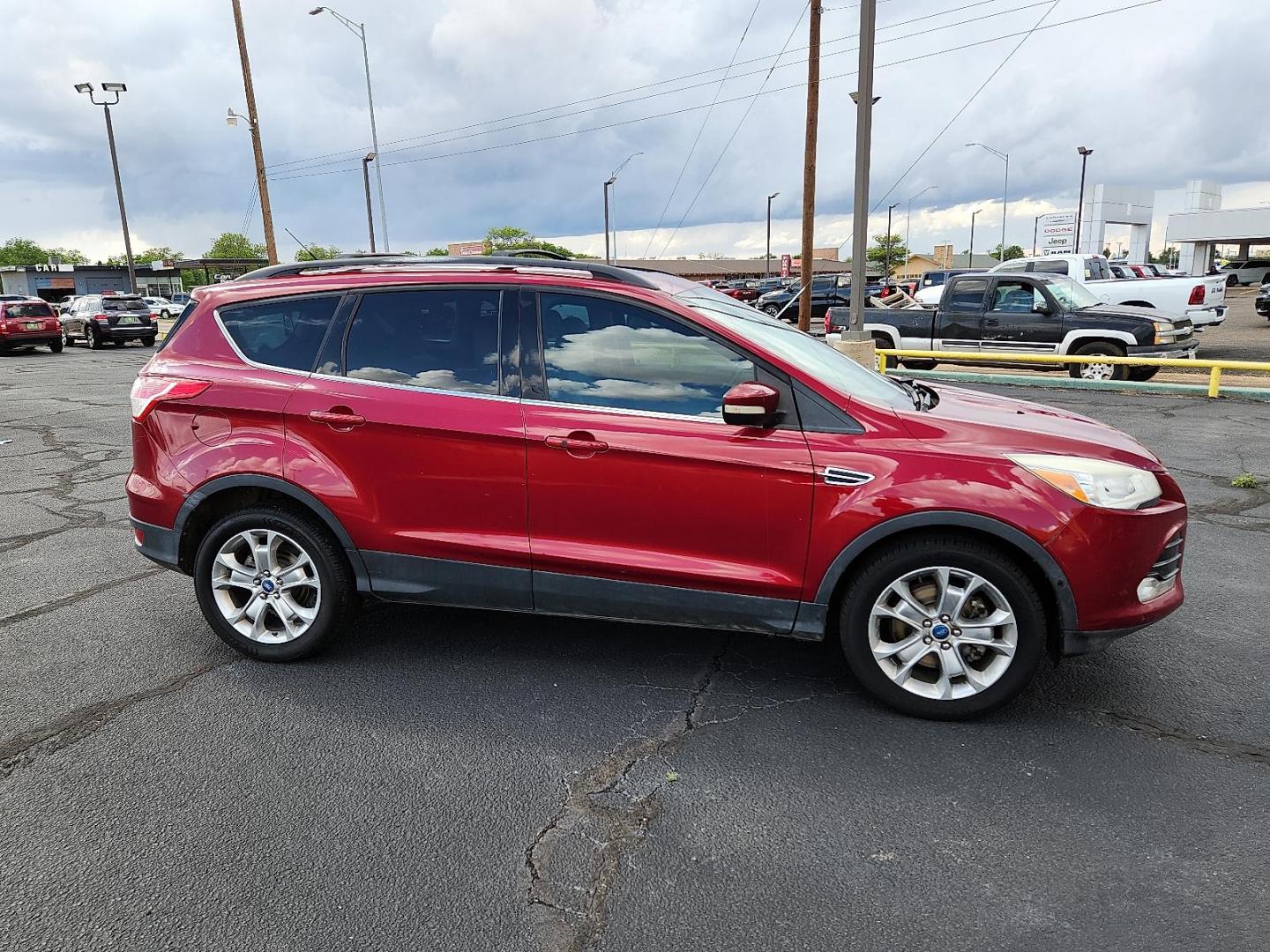 2013 Ruby Red Metallic Tinted Ford Escape SEL (1FMCU0H91DU) with an EcoBoost 2L I-4 gasoline direct injection, DOHC, variable valve control, intercooled turbo, regular unleaded, engine with 231HP engine, located at 4711 Ave Q, Lubbock, TX, 79412, (806) 687-2362, 33.551304, -101.855293 - Photo#4