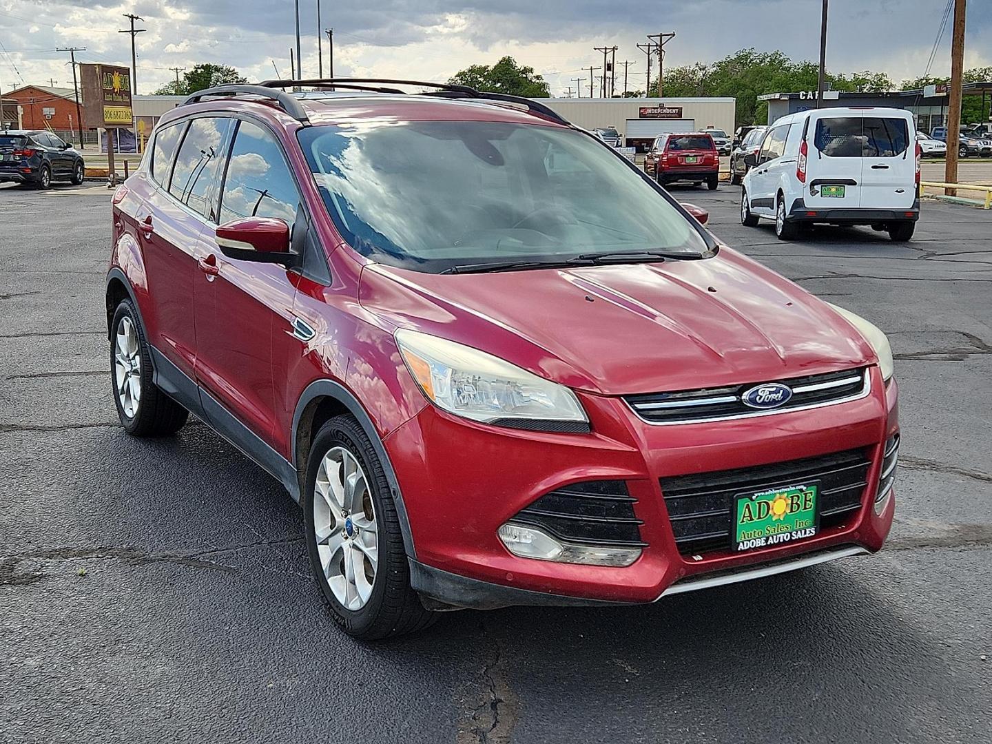 2013 Ruby Red Metallic Tinted Ford Escape SEL (1FMCU0H91DU) with an EcoBoost 2L I-4 gasoline direct injection, DOHC, variable valve control, intercooled turbo, regular unleaded, engine with 231HP engine, located at 4711 Ave Q, Lubbock, TX, 79412, (806) 687-2362, 33.551304, -101.855293 - Photo#5