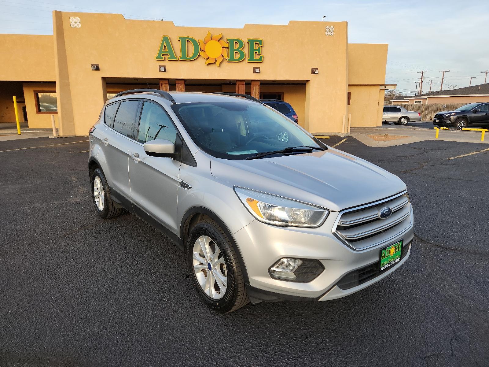 2018 Oxford White /Charcoal Black, cloth Ford Escape SE (1FMCU0GD5JU) with an ENGINE: 1.5L ECOBOOST engine, located at 4711 Ave Q, Lubbock, TX, 79412, (806) 687-2362, 33.551304, -101.855293 - Photo #6