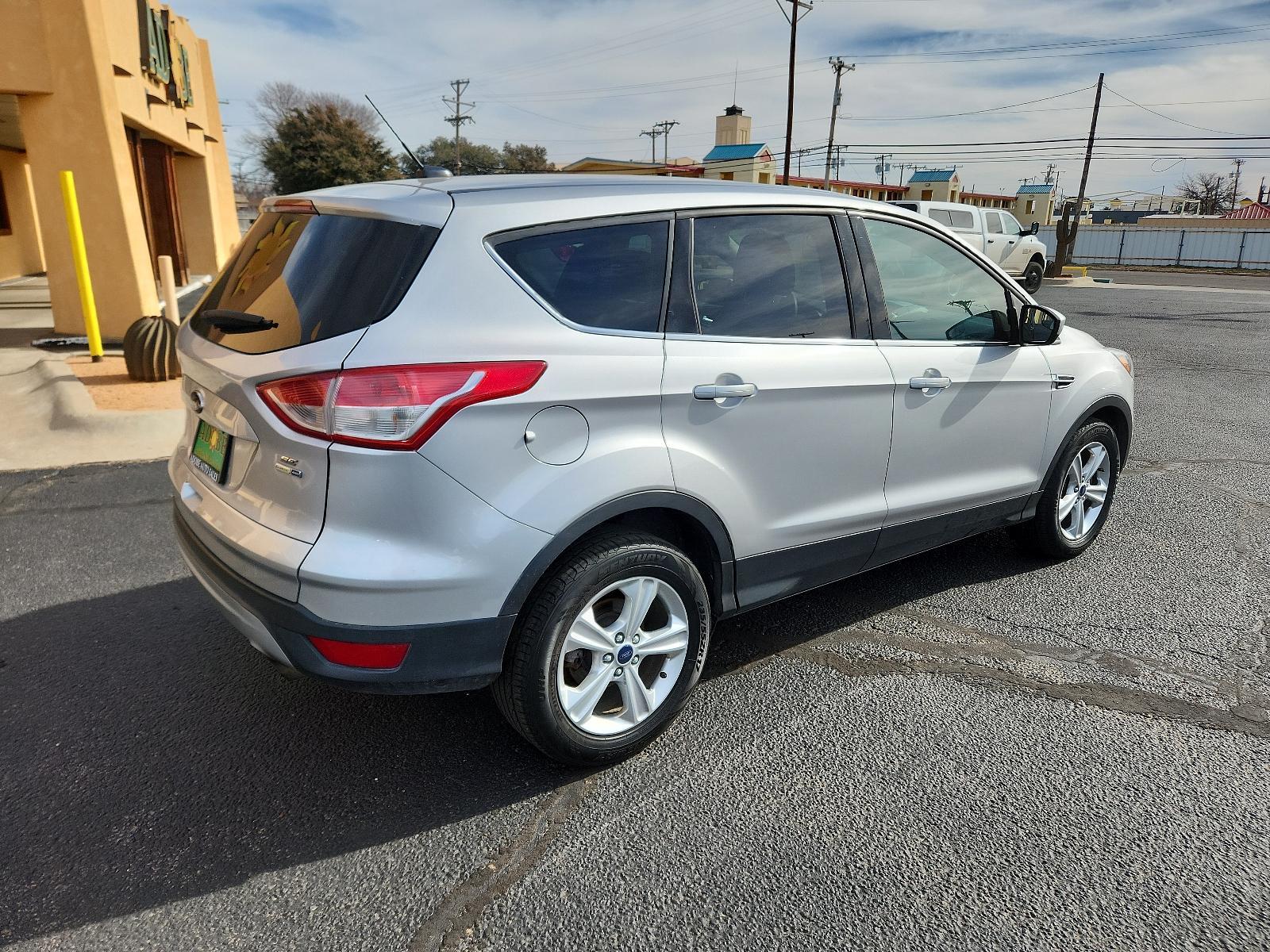 2015 Ingot Silver Metallic /Charcoal Black Ford Escape SE (1FMCU9GX2FU) with an ENGINE: 1.6L ECOBOOST engine, located at 4711 Ave Q, Lubbock, TX, 79412, (806) 687-2362, 33.551304, -101.855293 - Photo #4