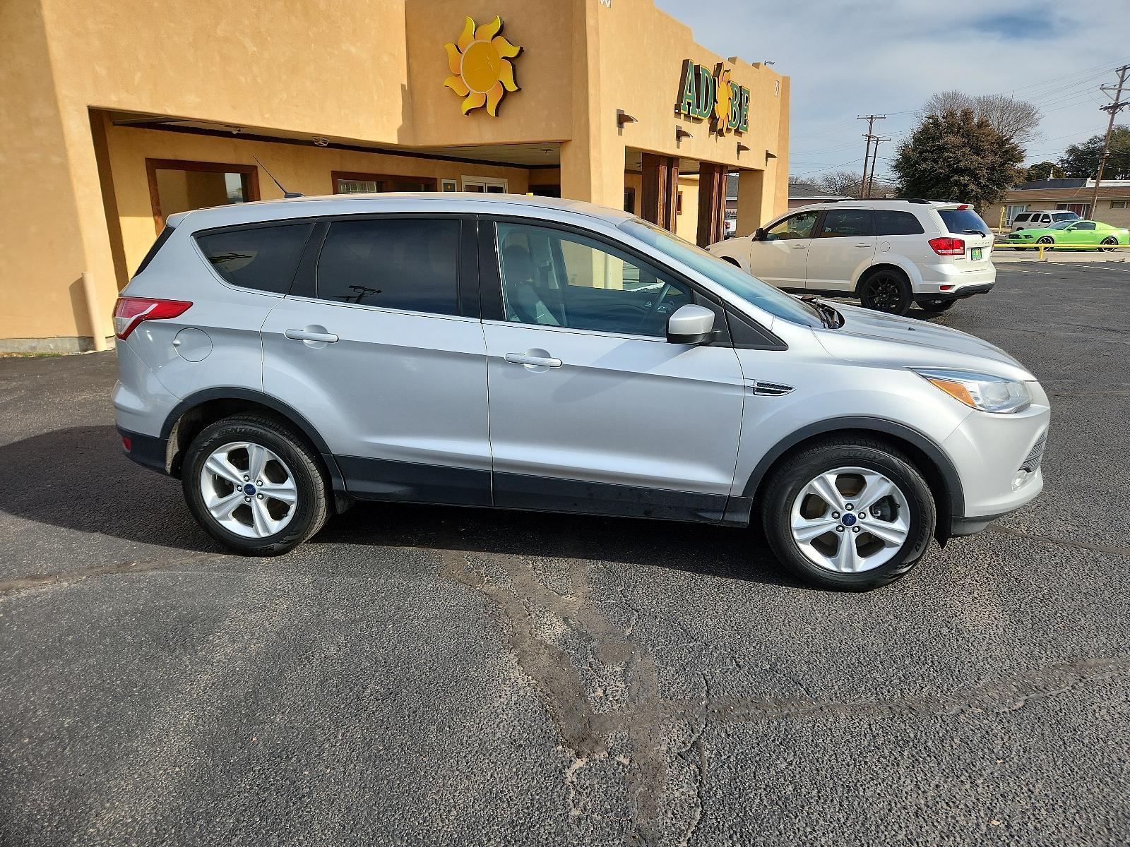 2015 Ingot Silver Metallic /Charcoal Black Ford Escape SE (1FMCU9GX2FU) with an ENGINE: 1.6L ECOBOOST engine, located at 4711 Ave Q, Lubbock, TX, 79412, (806) 687-2362, 33.551304, -101.855293 - Photo #5