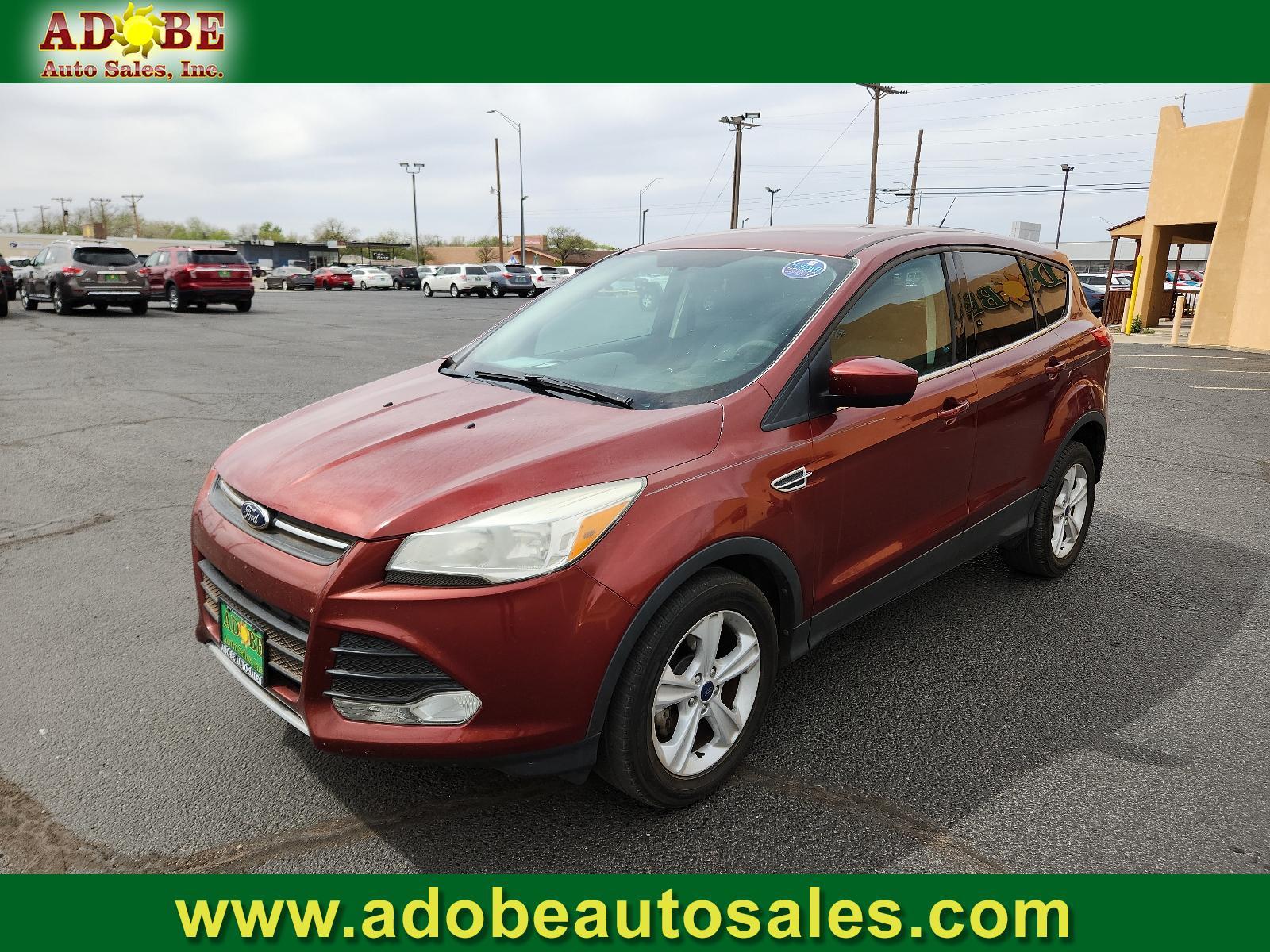 2014 Sunset /Charcoal Black Ford Escape SE (1FMCU0GX5EU) with an ENGINE: 1.6L ECOBOOST engine, located at 4711 Ave Q, Lubbock, TX, 79412, (806) 687-2362, 33.551304, -101.855293 - Photo #0