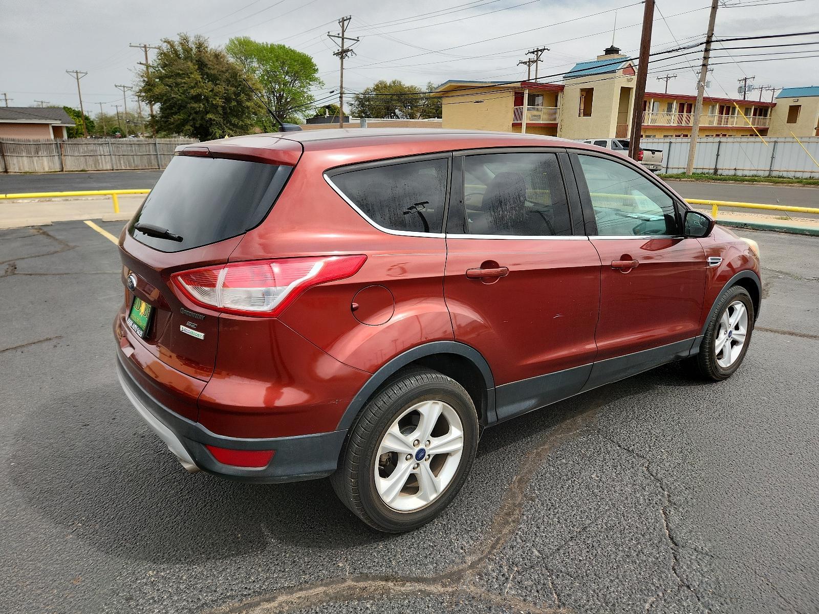 2014 Sunset /Charcoal Black Ford Escape SE (1FMCU0GX5EU) with an ENGINE: 1.6L ECOBOOST engine, located at 4711 Ave Q, Lubbock, TX, 79412, (806) 687-2362, 33.551304, -101.855293 - Photo #4
