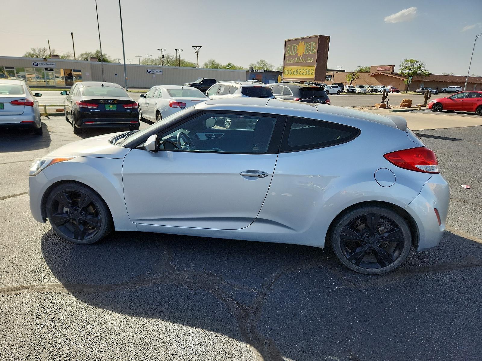 2017 Ironman Silver /Black, premium cloth Hyundai Veloster Value Edition (KMHTC6ADXHU) with an Engine: 1.6L 4-Cylinder GDI DOHC engine, located at 4711 Ave Q, Lubbock, TX, 79412, (806) 687-2362, 33.551304, -101.855293 - Photo #1