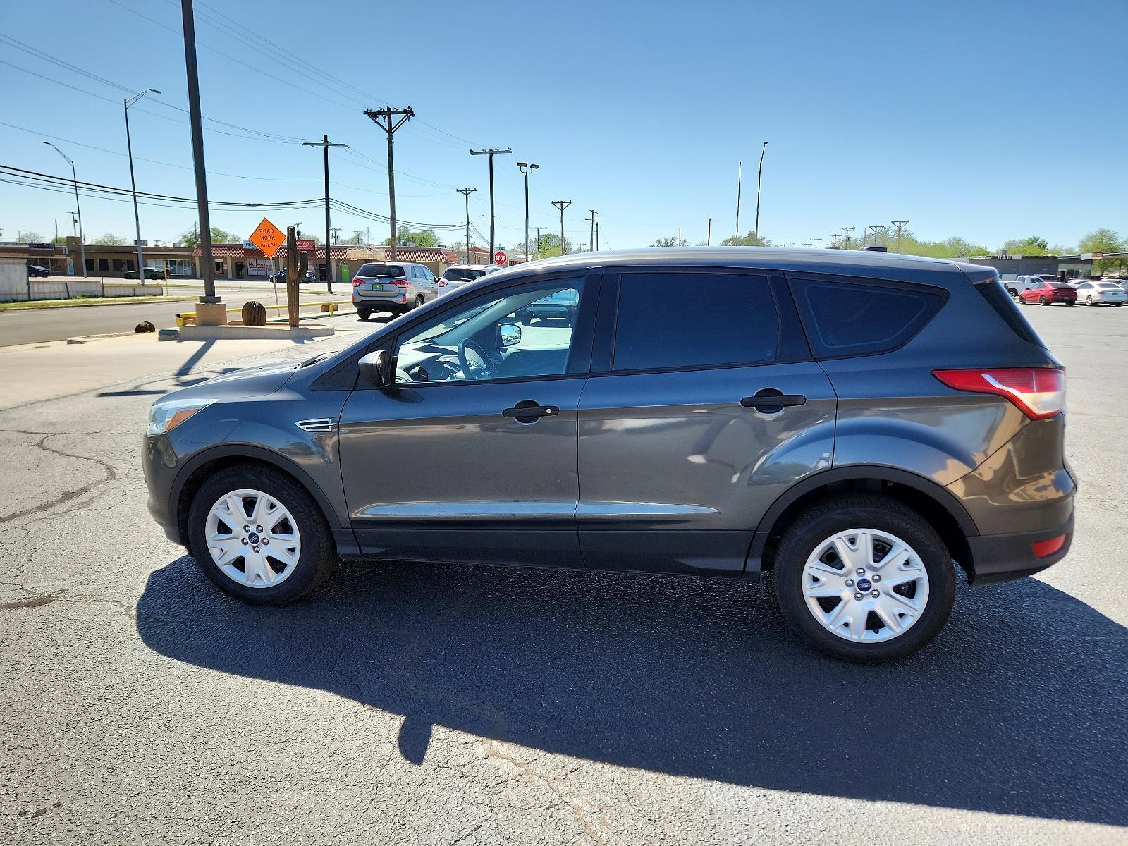 2016 Magnetic Metallic /Charcoal Black, cloth Ford Escape S (1FMCU0F77GU) with an ENGINE: DURATEC 2.5L I-4 engine, located at 4711 Ave Q, Lubbock, TX, 79412, (806) 687-2362, 33.551304, -101.855293 - Photo #1