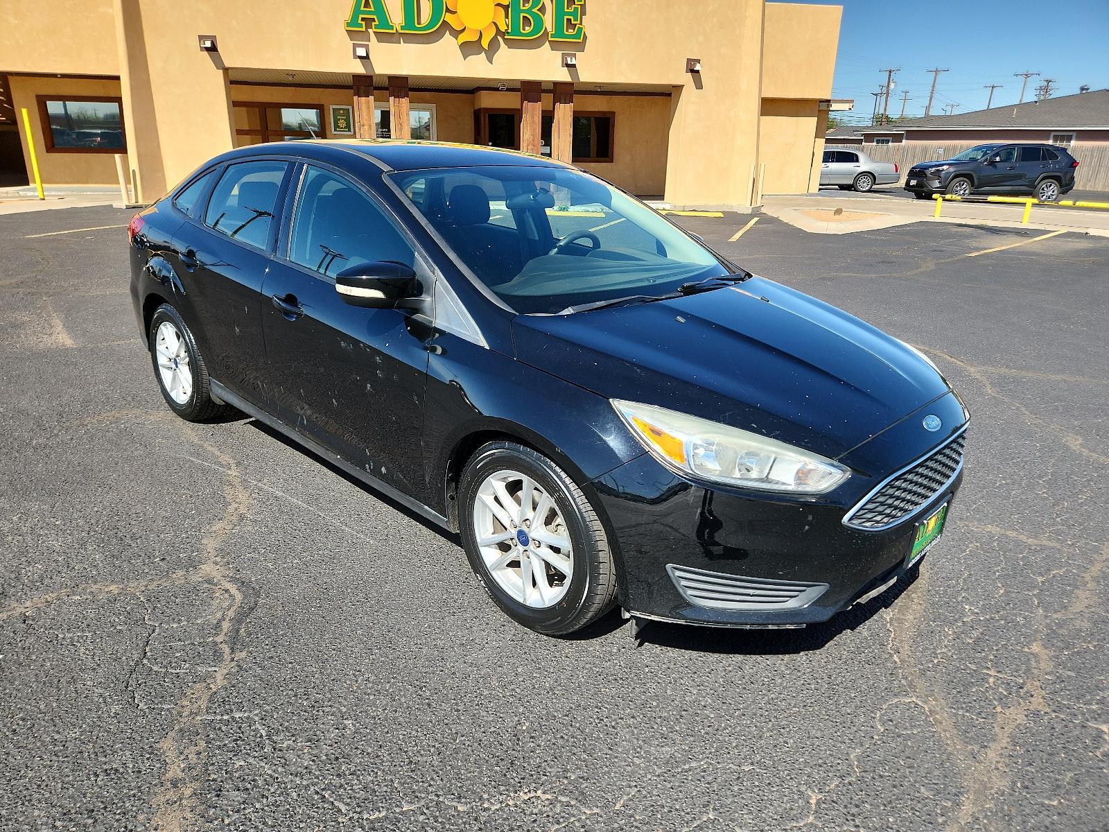 2017 Shadow Black /Charcoal Black Insert w/Warm Steel Surround, cloth Ford Focus SE (1FADP3F25HL) with an ENGINE: 2.0L I-4 GDI TI-VCT FLEX FUEL engine, located at 4711 Ave Q, Lubbock, TX, 79412, (806) 687-2362, 33.551304, -101.855293 - Photo #6