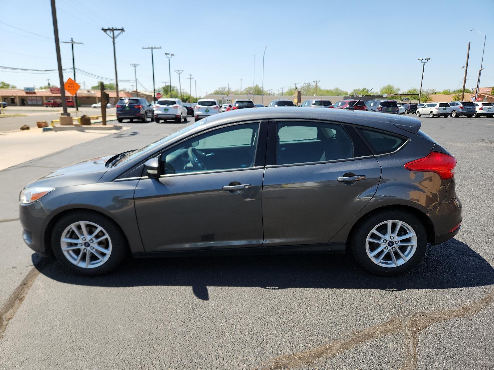 2017 Magnetic Metallic /Charcoal Black Insert w/Warm Steel Surround, cloth Ford Focus SE (1FADP3K29HL) with an ENGINE: 2.0L I-4 GDI TI-VCT FLEX FUEL engine, located at 4711 Ave Q, Lubbock, TX, 79412, (806) 687-2362, 33.551304, -101.855293 - Photo #1