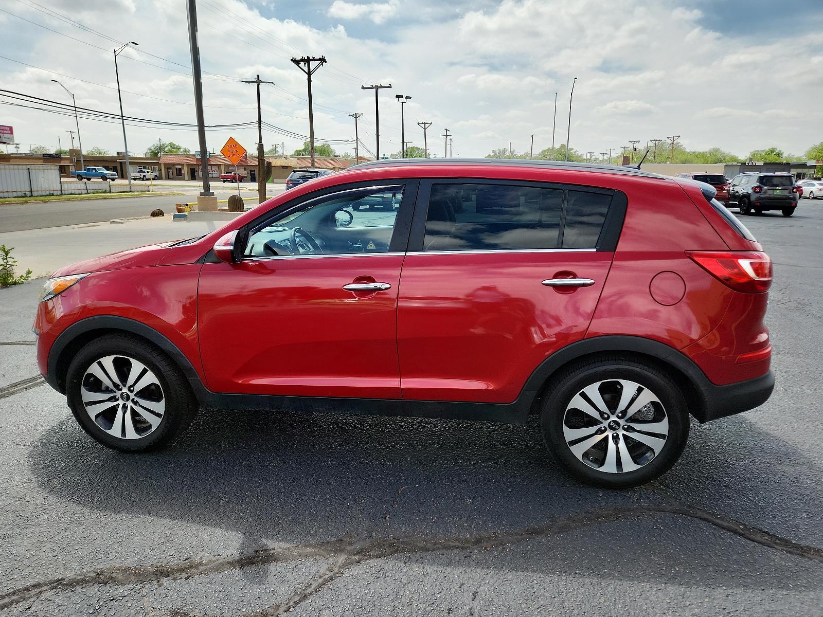 2012 Signal Red Metallic /Black Leather Interior Kia Sportage EX (KNDPC3A23C7) with an 2.4L DOHC 16-valve I4 engine engine, located at 4711 Ave Q, Lubbock, TX, 79412, (806) 687-2362, 33.551304, -101.855293 - Photo #1