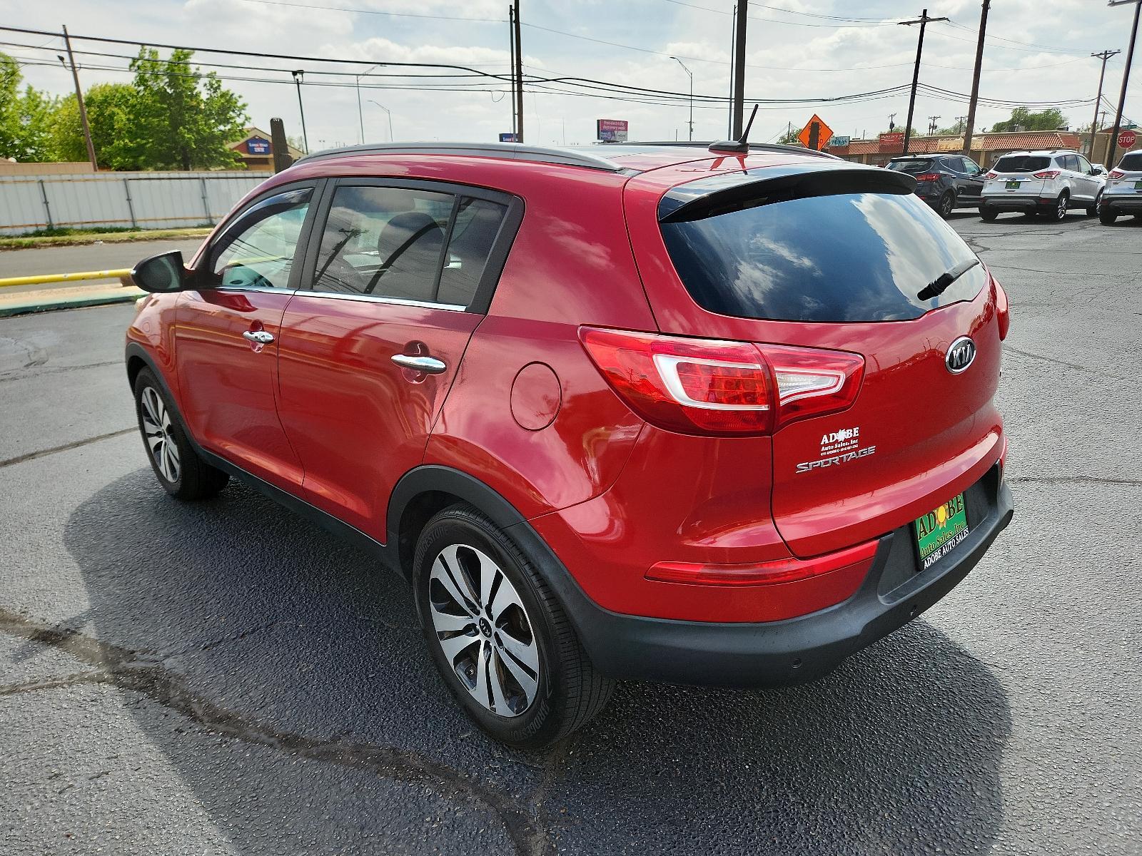 2012 Signal Red Metallic /Black Leather Interior Kia Sportage EX (KNDPC3A23C7) with an 2.4L DOHC 16-valve I4 engine engine, located at 4711 Ave Q, Lubbock, TX, 79412, (806) 687-2362, 33.551304, -101.855293 - Photo #2