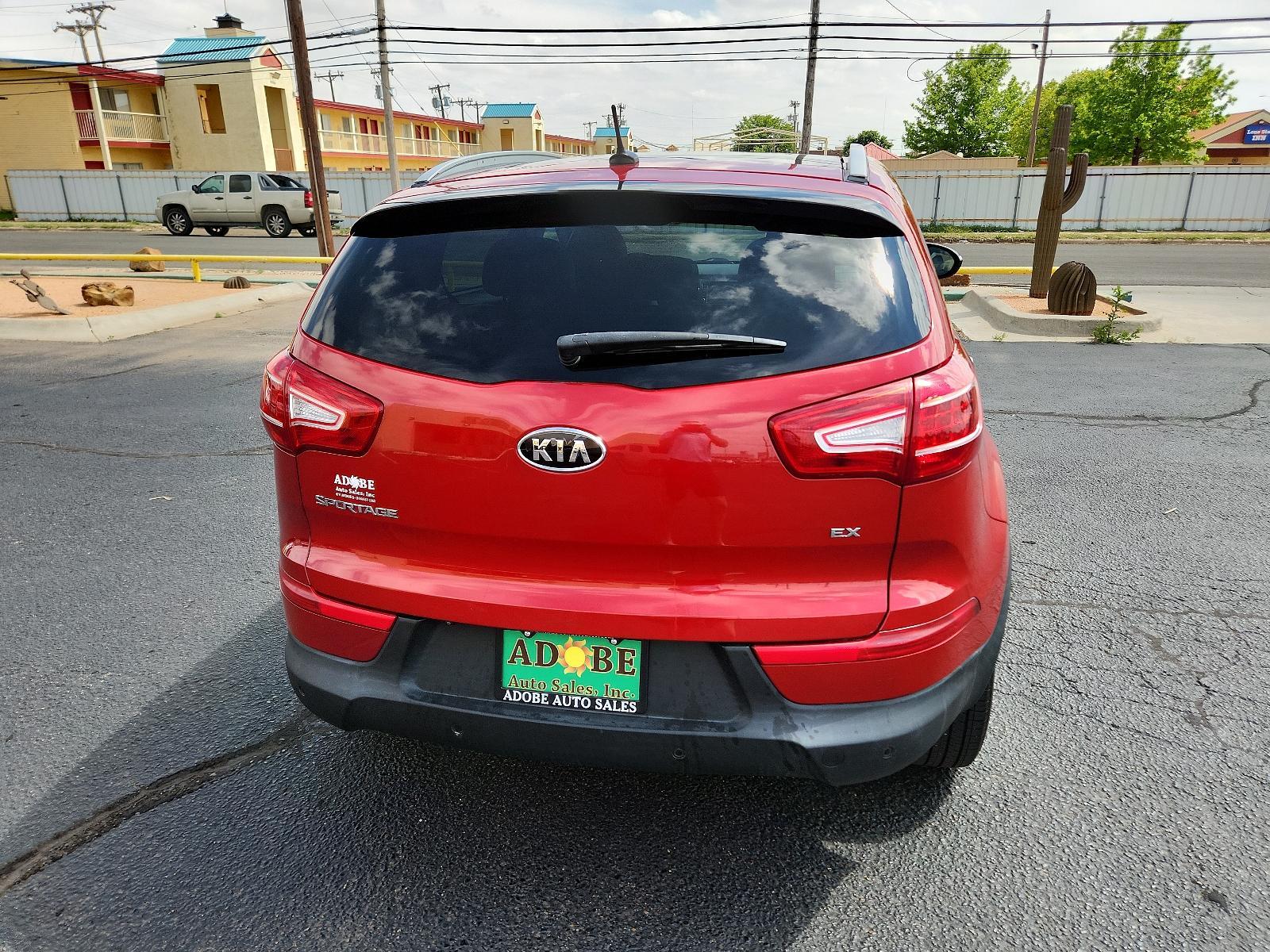 2012 Signal Red Metallic /Black Leather Interior Kia Sportage EX (KNDPC3A23C7) with an 2.4L DOHC 16-valve I4 engine engine, located at 4711 Ave Q, Lubbock, TX, 79412, (806) 687-2362, 33.551304, -101.855293 - Photo #3