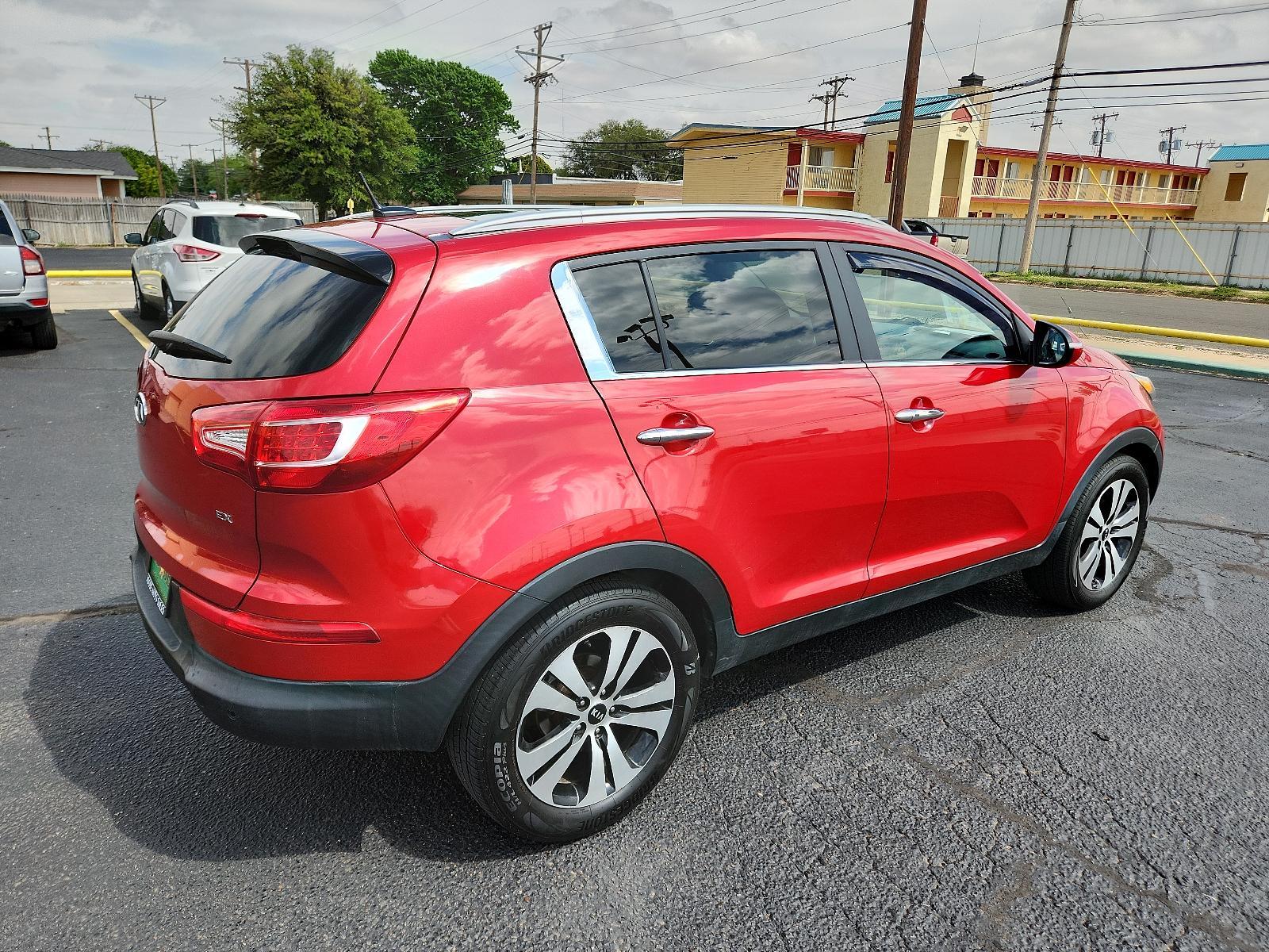 2012 Signal Red Metallic /Black Leather Interior Kia Sportage EX (KNDPC3A23C7) with an 2.4L DOHC 16-valve I4 engine engine, located at 4711 Ave Q, Lubbock, TX, 79412, (806) 687-2362, 33.551304, -101.855293 - Photo #4