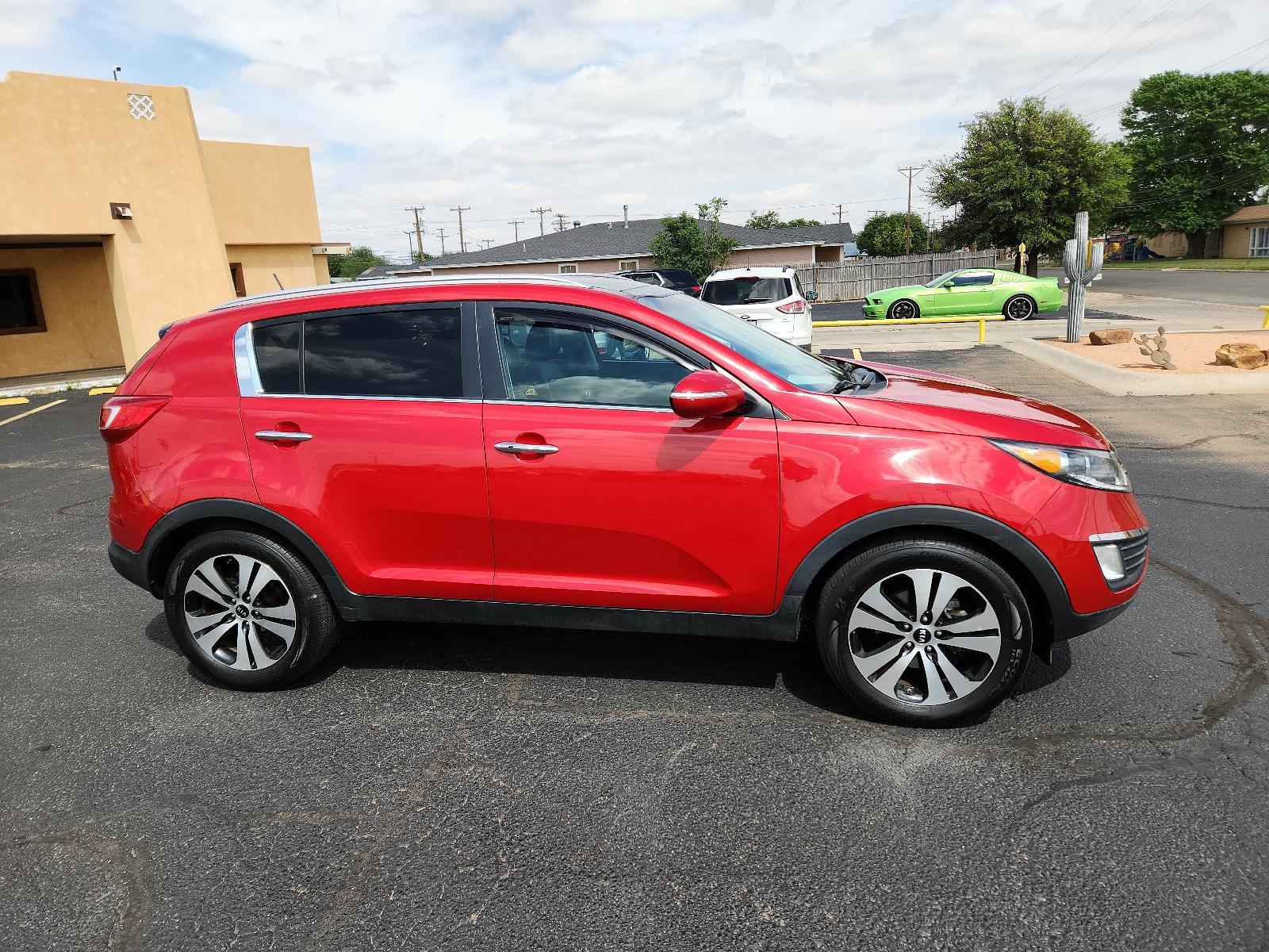 2012 Signal Red Metallic /Black Leather Interior Kia Sportage EX (KNDPC3A23C7) with an 2.4L DOHC 16-valve I4 engine engine, located at 4711 Ave Q, Lubbock, TX, 79412, (806) 687-2362, 33.551304, -101.855293 - Photo #5