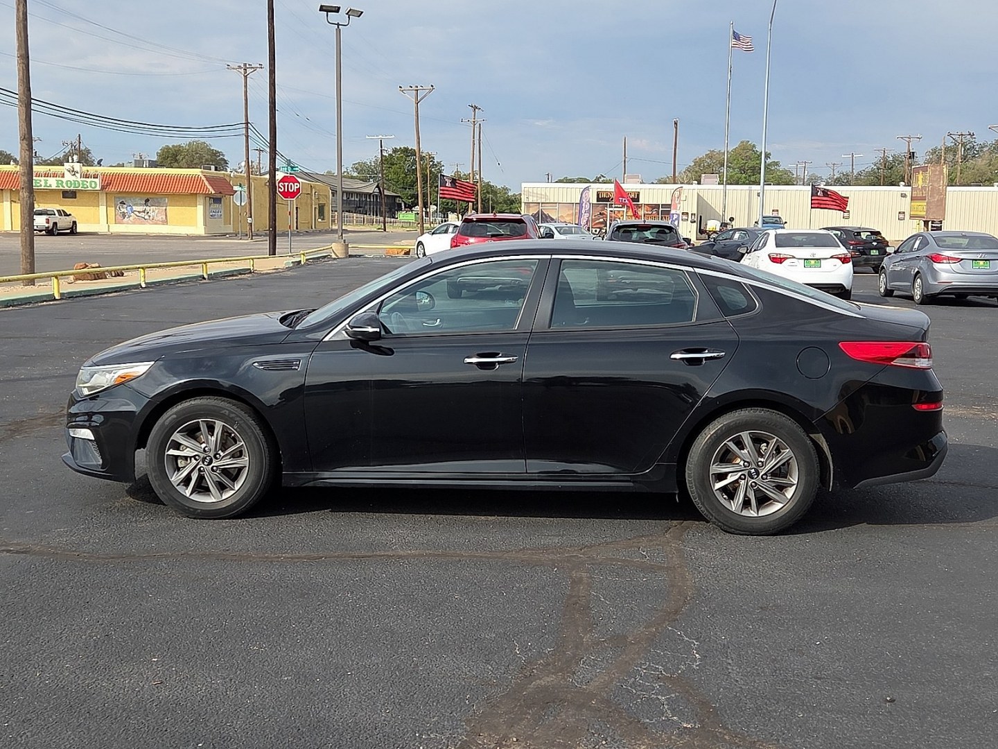 2019 Ebony Black - EB /Black - WK Kia Optima LX (5XXGT4L39KG) with an Theta II 2.4L I-4 direct injection, DOHC, D-CVVT variable valve control, regular gasoline, engine with 185HP engine, located at 4711 Ave Q, Lubbock, TX, 79412, (806) 687-2362, 33.551304, -101.855293- Photo#1