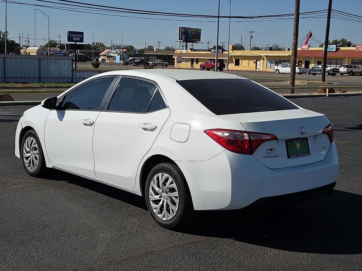 2019 Super White - 040 /Black - 21 Toyota Corolla LE (2T1BURHE5KC) with an 1.8L I-4 DOHC, VVT-i variable valve control, regular gasoline, engine with 132HP engine, located at 4711 Ave Q, Lubbock, TX, 79412, (806) 687-2362, 33.551304, -101.855293- Photo#2