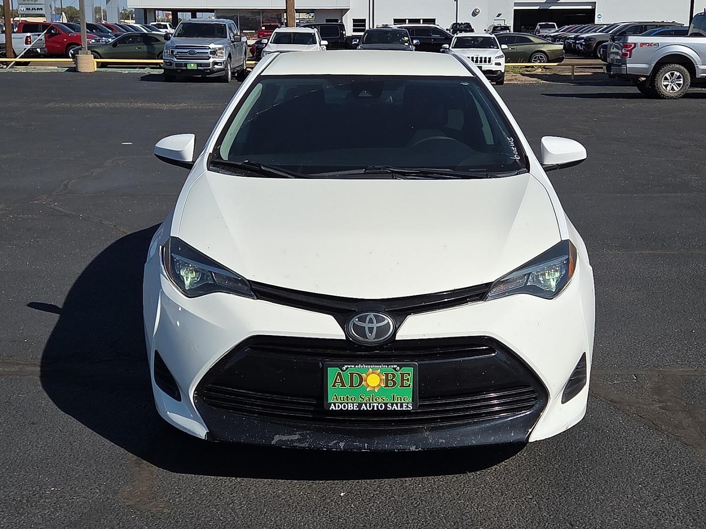 2019 Super White - 040 /Black - 21 Toyota Corolla LE (2T1BURHE5KC) with an 1.8L I-4 DOHC, VVT-i variable valve control, regular gasoline, engine with 132HP engine, located at 4711 Ave Q, Lubbock, TX, 79412, (806) 687-2362, 33.551304, -101.855293- Photo#7