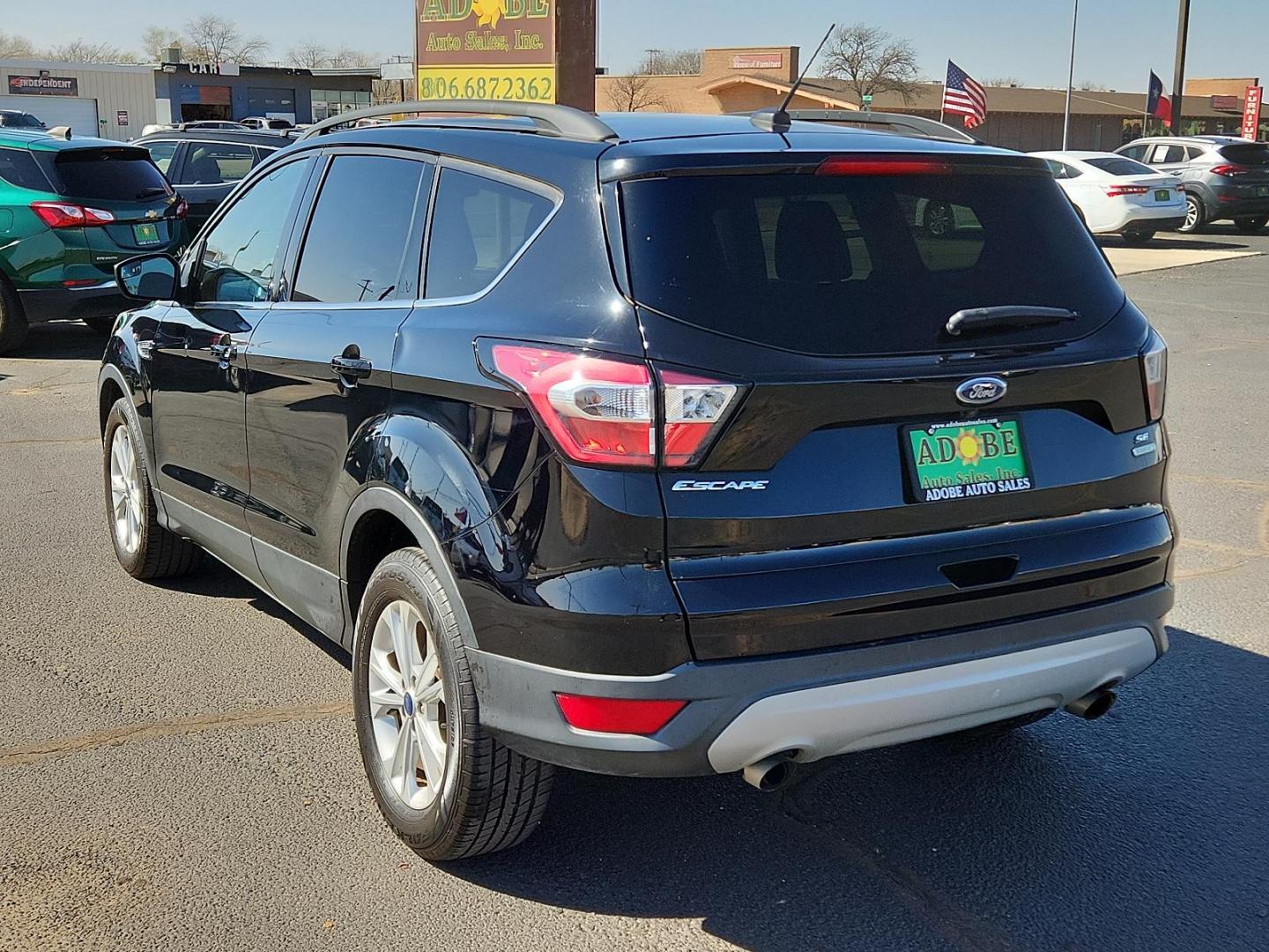 2018 BLACK Ford Escape SE (1FMCU0GD8JU) with an ENGINE: 1.5L ECOBOOST engine, located at 4711 Ave Q, Lubbock, TX, 79412, (806) 687-2362, 33.551304, -101.855293 - Photo#2
