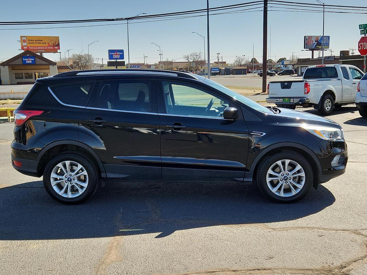 2018 BLACK Ford Escape SE (1FMCU0GD8JU) with an ENGINE: 1.5L ECOBOOST engine, located at 4711 Ave Q, Lubbock, TX, 79412, (806) 687-2362, 33.551304, -101.855293 - Photo#4