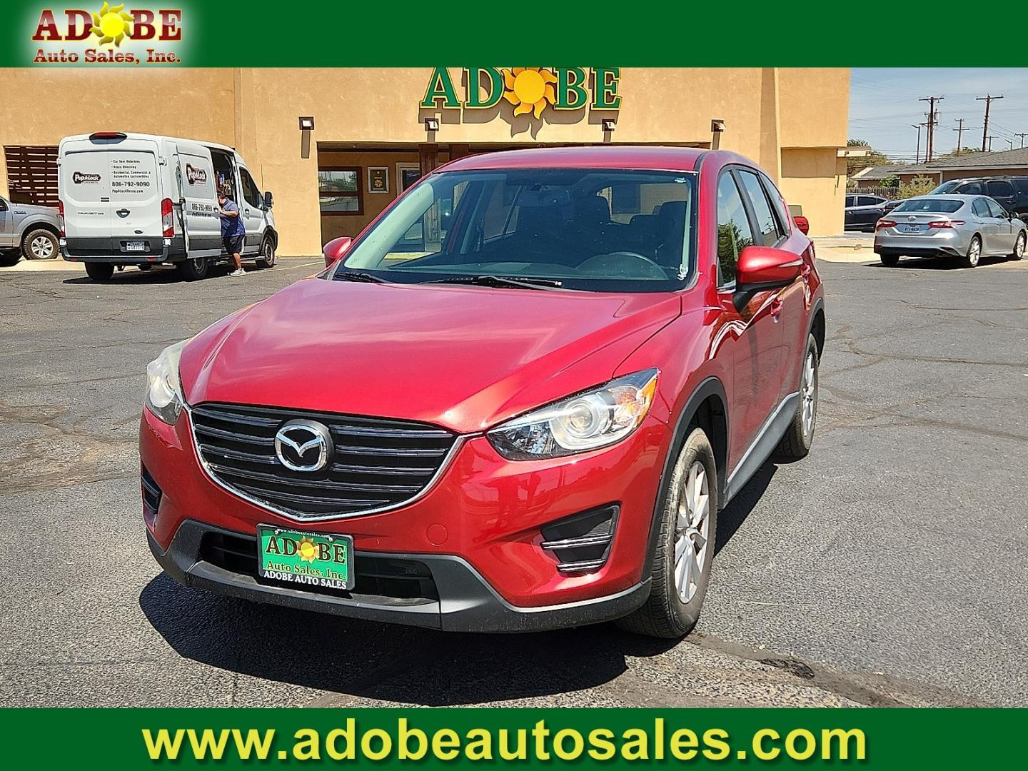 2016 RED /Black - KC3 Mazda CX-5 Sport (JM3KE2BY4G0) with an SKYACTIV-G 2.5L I-4 gasoline direct injection, DOHC, variable valve control, regular unleaded, engine with 184HP engine, located at 4711 Ave Q, Lubbock, TX, 79412, (806) 687-2362, 33.551304, -101.855293- Photo#0