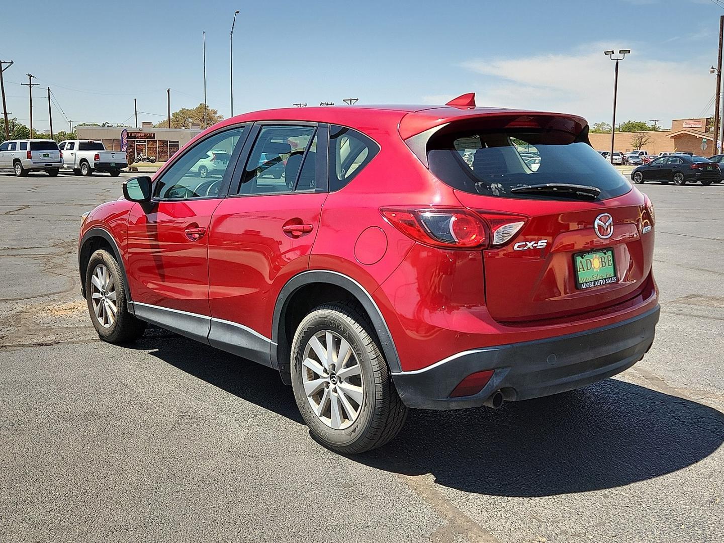 2016 RED /Black - KC3 Mazda CX-5 Sport (JM3KE2BY4G0) with an SKYACTIV-G 2.5L I-4 gasoline direct injection, DOHC, variable valve control, regular unleaded, engine with 184HP engine, located at 4711 Ave Q, Lubbock, TX, 79412, (806) 687-2362, 33.551304, -101.855293- Photo#2