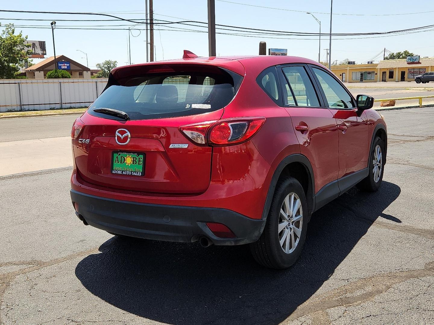 2016 RED /Black - KC3 Mazda CX-5 Sport (JM3KE2BY4G0) with an SKYACTIV-G 2.5L I-4 gasoline direct injection, DOHC, variable valve control, regular unleaded, engine with 184HP engine, located at 4711 Ave Q, Lubbock, TX, 79412, (806) 687-2362, 33.551304, -101.855293- Photo#3