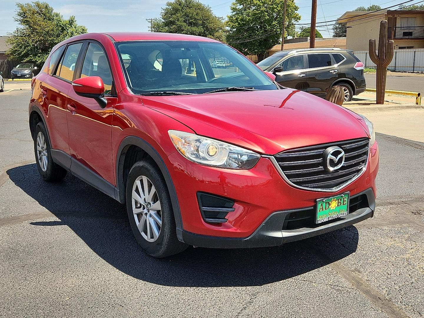 2016 RED /Black - KC3 Mazda CX-5 Sport (JM3KE2BY4G0) with an SKYACTIV-G 2.5L I-4 gasoline direct injection, DOHC, variable valve control, regular unleaded, engine with 184HP engine, located at 4711 Ave Q, Lubbock, TX, 79412, (806) 687-2362, 33.551304, -101.855293- Photo#5