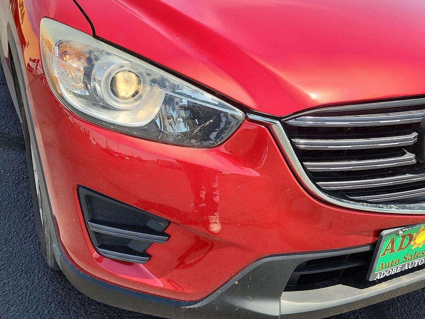 2016 RED /Black - KC3 Mazda CX-5 Sport (JM3KE2BY4G0) with an SKYACTIV-G 2.5L I-4 gasoline direct injection, DOHC, variable valve control, regular unleaded, engine with 184HP engine, located at 4711 Ave Q, Lubbock, TX, 79412, (806) 687-2362, 33.551304, -101.855293- Photo#7
