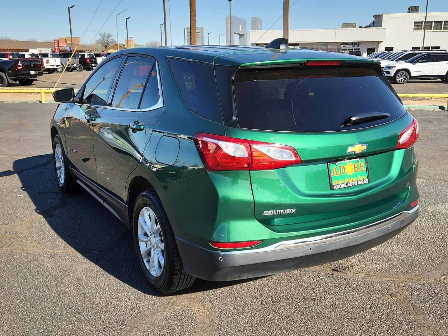 2019 Ivy Metallic Chevrolet Equinox LT (2GNAXKEV0K6) with an ENGINE, 1.5L TURBO DOHC 4-CYLINDER, SIDI, VVT engine, located at 4711 Ave Q, Lubbock, TX, 79412, (806) 687-2362, 33.551304, -101.855293 - Photo#2