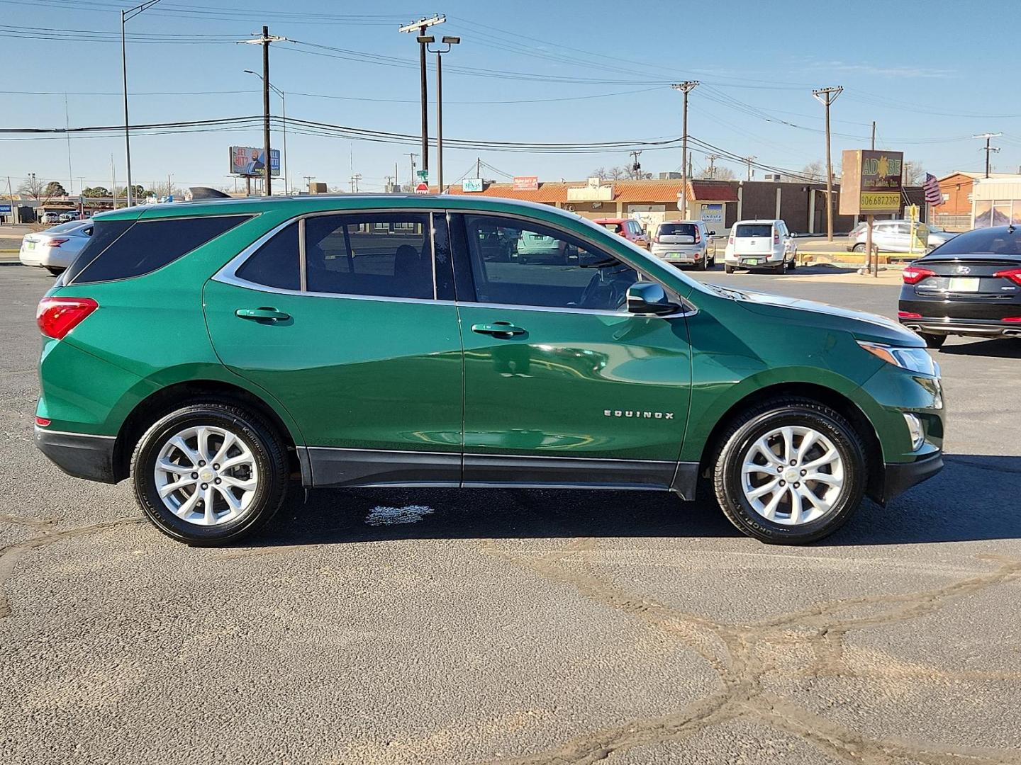 2019 Ivy Metallic Chevrolet Equinox LT (2GNAXKEV0K6) with an ENGINE, 1.5L TURBO DOHC 4-CYLINDER, SIDI, VVT engine, located at 4711 Ave Q, Lubbock, TX, 79412, (806) 687-2362, 33.551304, -101.855293 - Photo#4