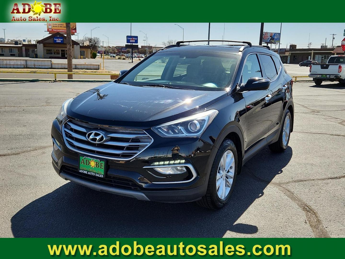 2018 Twilight Black Hyundai Santa Fe Sport 2.0T (5XYZU4LA5JG) with an Engine: 2.0L Turbo-GDI DOHC 16-Valve I4 engine, located at 4711 Ave Q, Lubbock, TX, 79412, (806) 687-2362, 33.551304, -101.855293 - Photo#0
