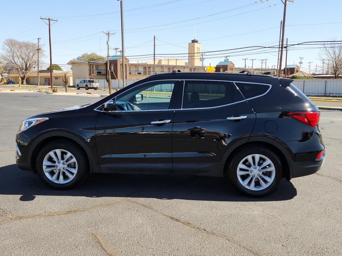 2018 Twilight Black Hyundai Santa Fe Sport 2.0T (5XYZU4LA5JG) with an Engine: 2.0L Turbo-GDI DOHC 16-Valve I4 engine, located at 4711 Ave Q, Lubbock, TX, 79412, (806) 687-2362, 33.551304, -101.855293 - Photo#1