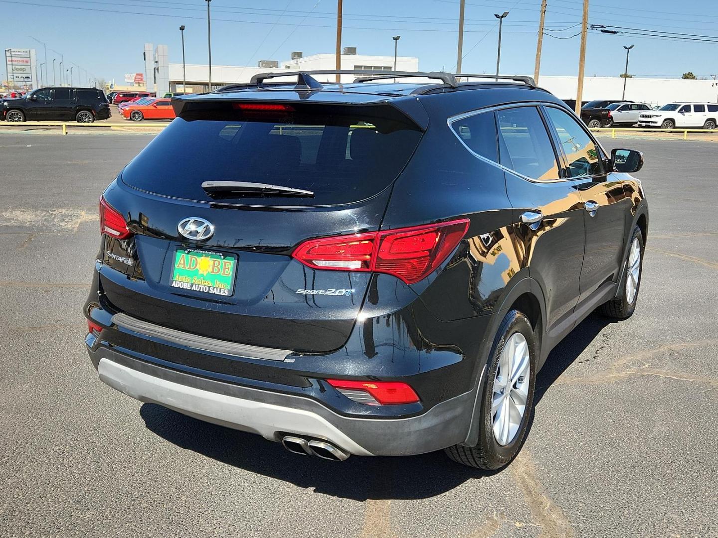 2018 Twilight Black Hyundai Santa Fe Sport 2.0T (5XYZU4LA5JG) with an Engine: 2.0L Turbo-GDI DOHC 16-Valve I4 engine, located at 4711 Ave Q, Lubbock, TX, 79412, (806) 687-2362, 33.551304, -101.855293 - Photo#3