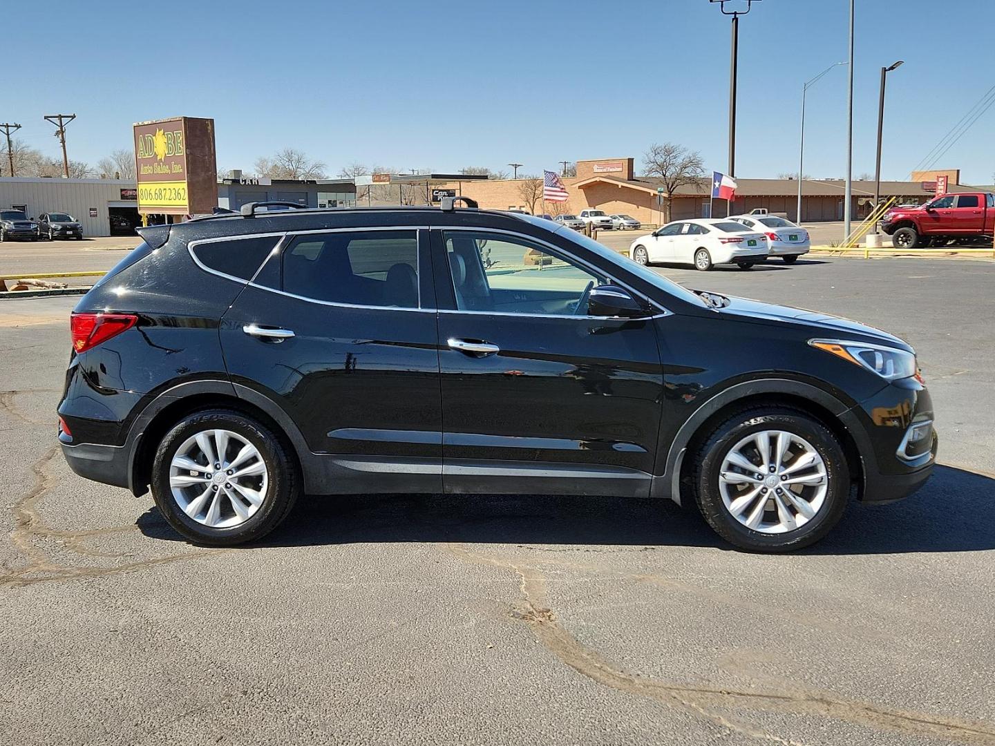 2018 Twilight Black Hyundai Santa Fe Sport 2.0T (5XYZU4LA5JG) with an Engine: 2.0L Turbo-GDI DOHC 16-Valve I4 engine, located at 4711 Ave Q, Lubbock, TX, 79412, (806) 687-2362, 33.551304, -101.855293 - Photo#4