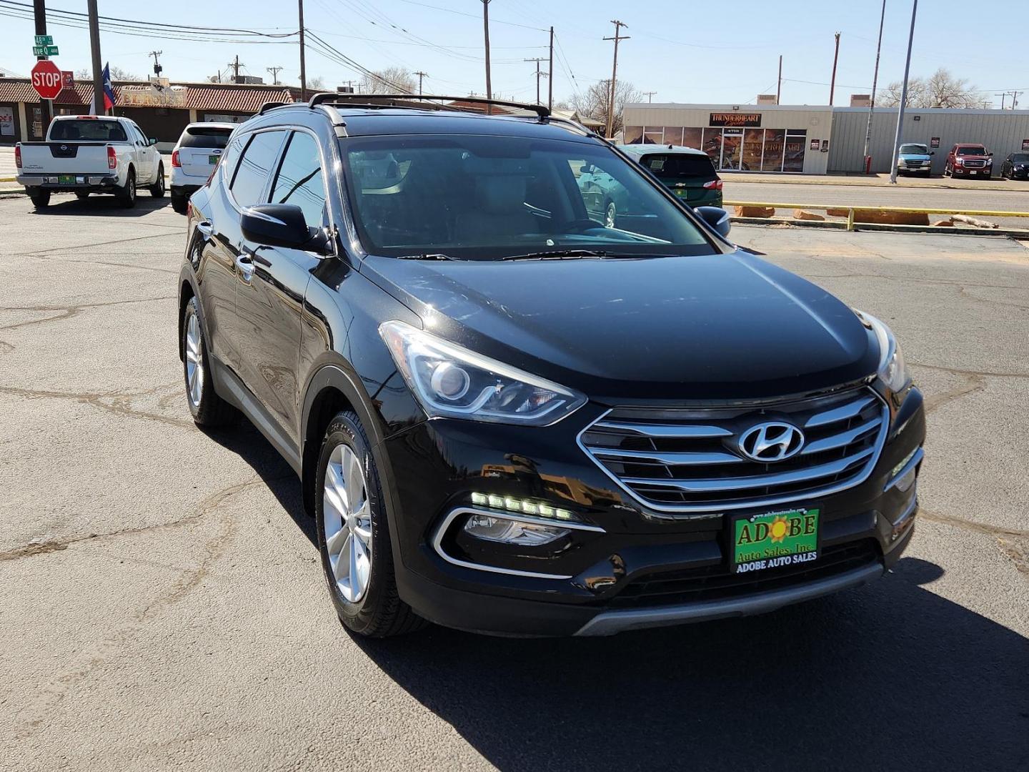 2018 Twilight Black Hyundai Santa Fe Sport 2.0T (5XYZU4LA5JG) with an Engine: 2.0L Turbo-GDI DOHC 16-Valve I4 engine, located at 4711 Ave Q, Lubbock, TX, 79412, (806) 687-2362, 33.551304, -101.855293 - Photo#5
