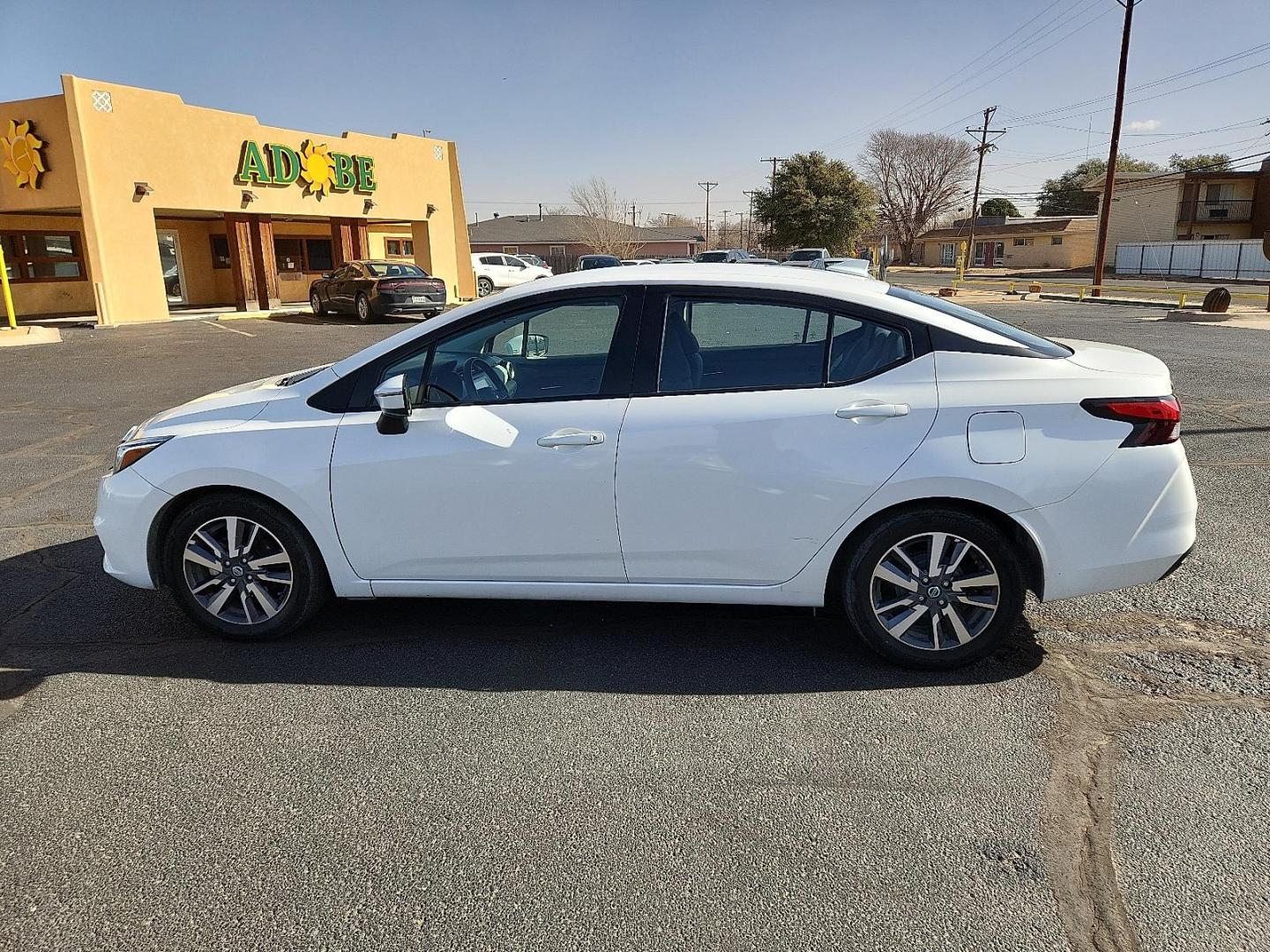 2020 WHITE Nissan Versa SV Xtronic CVT (3N1CN8EV9LL) with an 1.6L I-4 DOHC, variable valve control, regular unleaded, engine with 122HP engine, located at 4711 Ave Q, Lubbock, TX, 79412, (806) 687-2362, 33.551304, -101.855293 - Photo#1