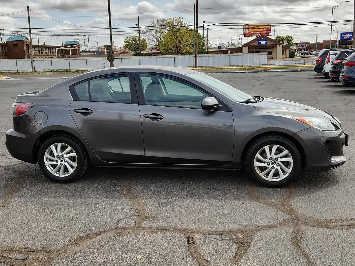 2013 Graphite Mica - 38R /Black - BU4 Mazda Mazda3 i Touring (JM1BL1V85D1) with an 2.0L DOHC 16-valve SKYACTIV-G I4 engine -inc: variable valve timing (VVT) engine, located at 4711 Ave Q, Lubbock, TX, 79412, (806) 687-2362, 33.551304, -101.855293 - Photo#4