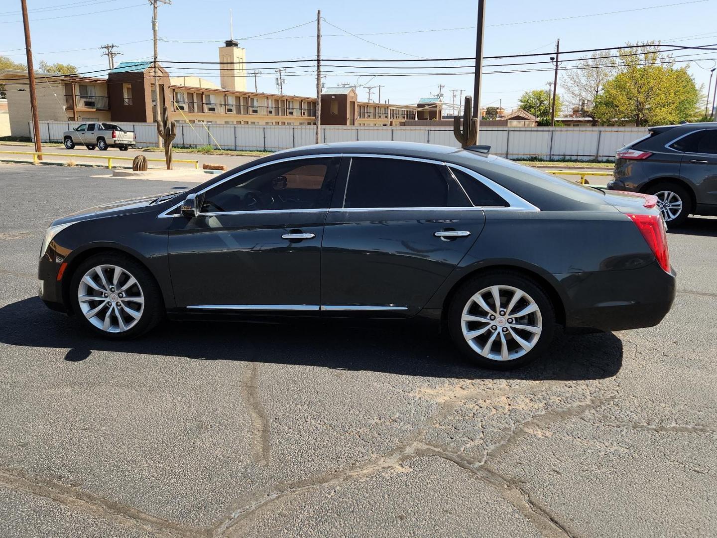 2015 Graphite Metallic - GLJ /Jet Black - AFC Cadillac XTS Luxury (2G61M5S33F9) with an ENGINE, 3.6L SIDI DOHC V6 VVT engine, located at 4711 Ave Q, Lubbock, TX, 79412, (806) 687-2362, 33.551304, -101.855293 - Photo#1