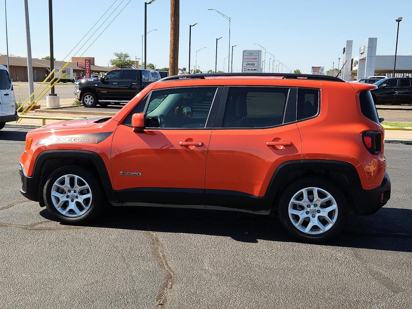2015 Omaha Orange Jeep Renegade Latitude (ZACCJABT4FP) with an MultiAir2 Tigershark 2.4L I-4 variable valve control, regular unleaded, engine with 180HP engine, located at 4711 Ave Q, Lubbock, TX, 79412, (806) 687-2362, 33.551304, -101.855293 - Photo#1