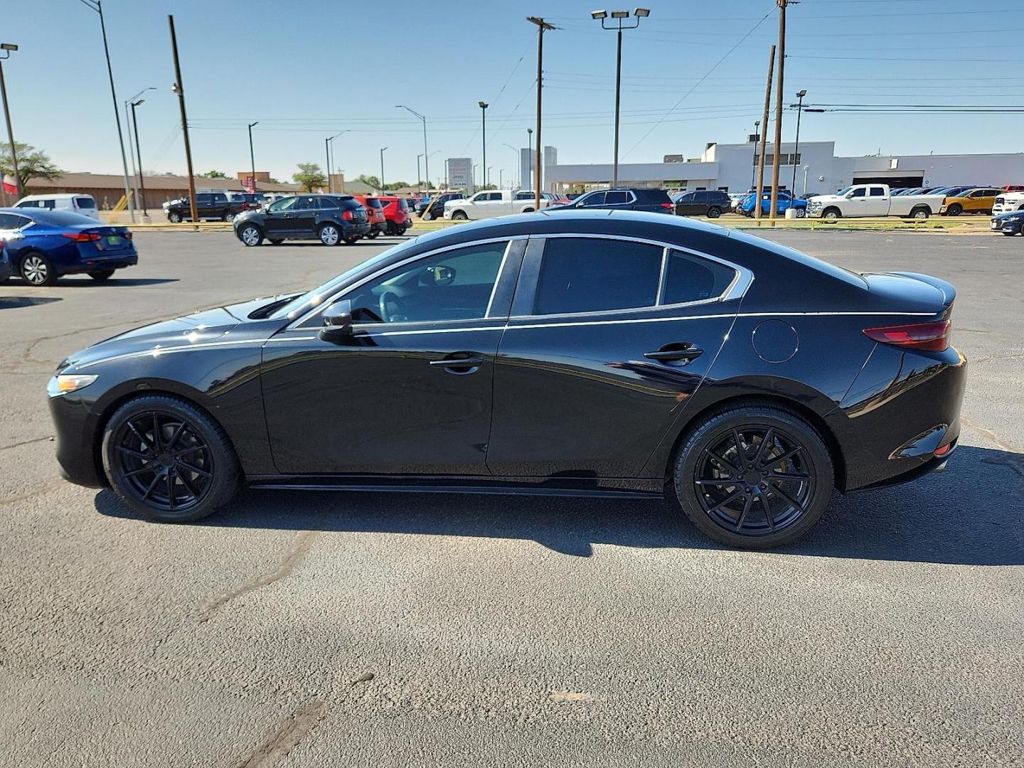 2020 Jet Black Mica Mazda Mazda3 Sedan Select Package (3MZBPBCM8LM) with an SKYACTIV-G 2.5L I-4 gasoline direct injection, DOHC, variable valve control, regular unleaded, engine with cylinder deactivation and 186HP engine, located at 4711 Ave Q, Lubbock, TX, 79412, (806) 687-2362, 33.551304, -101.855293 - Photo#1
