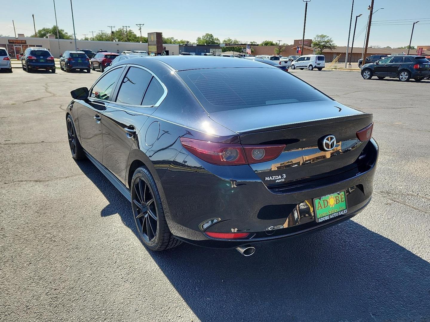 2020 Jet Black Mica Mazda Mazda3 Sedan Select Package (3MZBPBCM8LM) with an SKYACTIV-G 2.5L I-4 gasoline direct injection, DOHC, variable valve control, regular unleaded, engine with cylinder deactivation and 186HP engine, located at 4711 Ave Q, Lubbock, TX, 79412, (806) 687-2362, 33.551304, -101.855293 - Photo#2